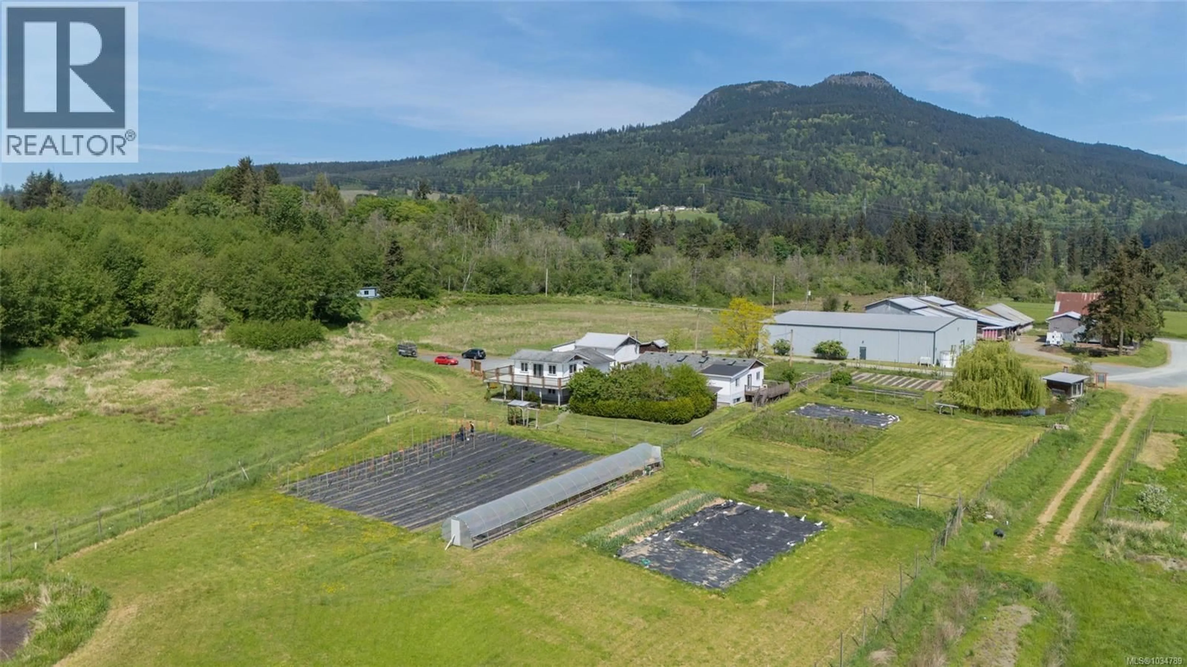 A pic from outside/outdoor area/front of a property/back of a property/a pic from drone, mountain view for 3504 DRINKWATER ROAD, Duncan British Columbia V9L5Z2
