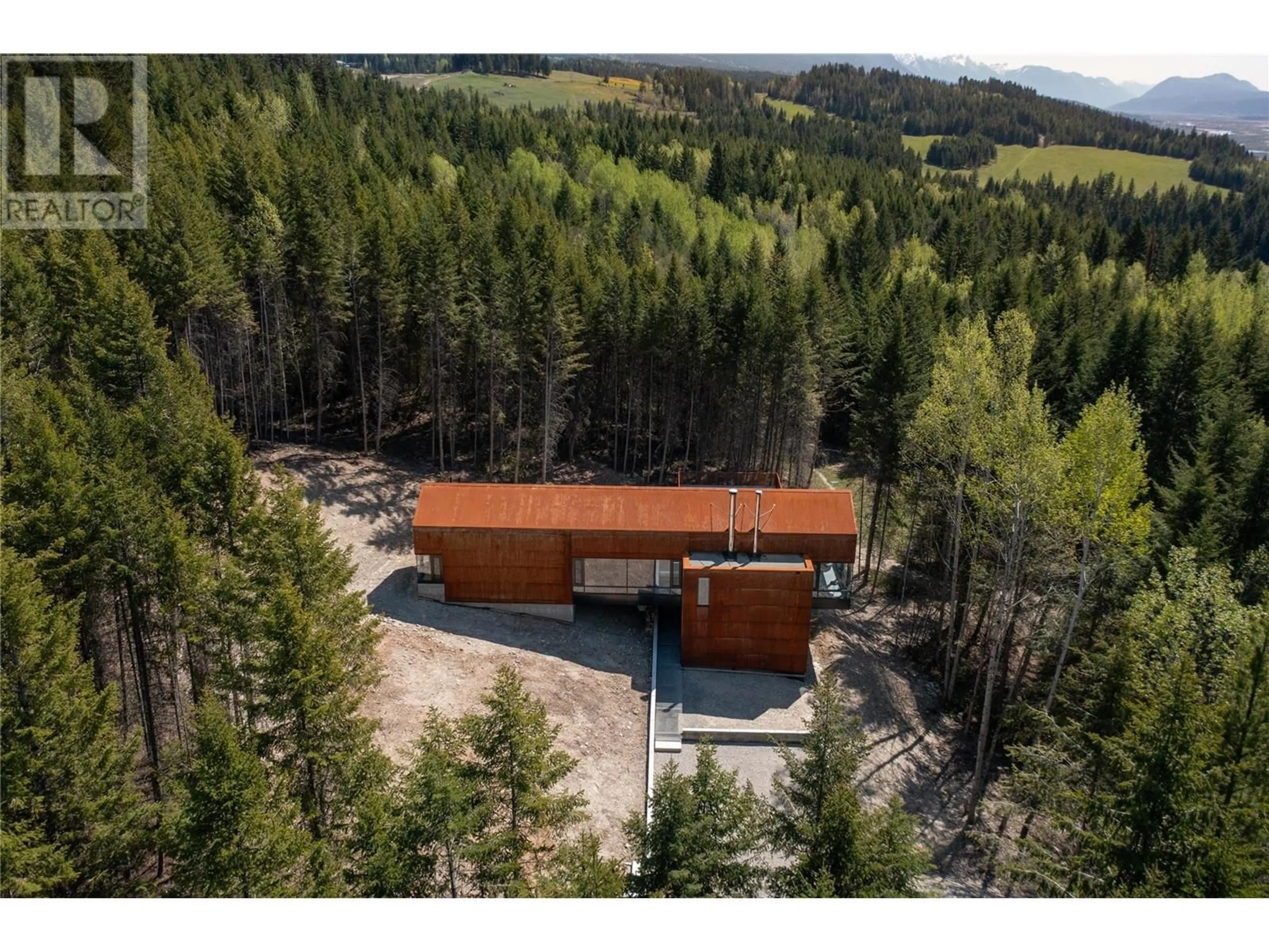 A pic from outside/outdoor area/front of a property/back of a property/a pic from drone, forest/trees view for 2060 MCMURDO ROAD, Golden British Columbia V0A1H7