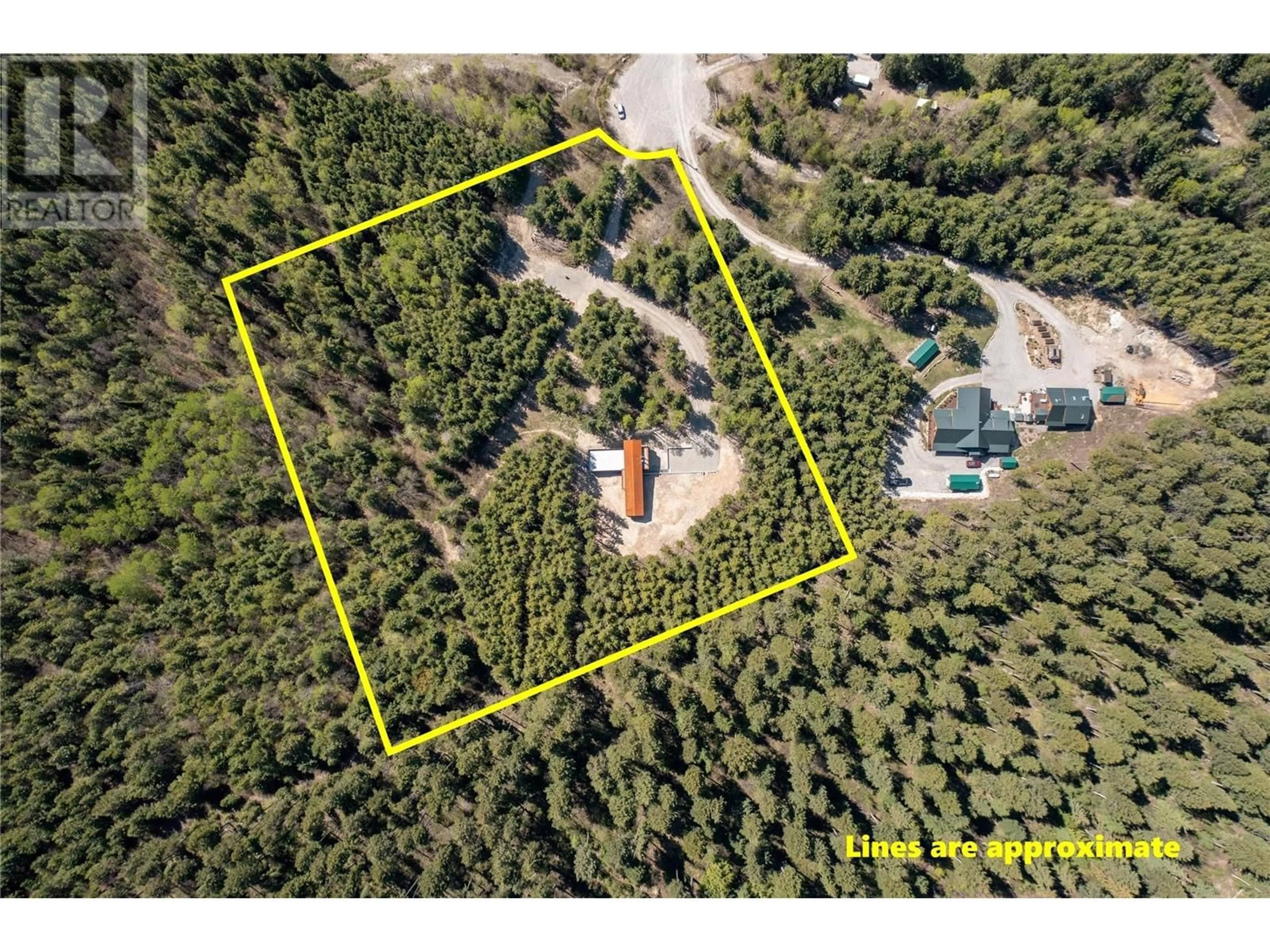 A pic from outside/outdoor area/front of a property/back of a property/a pic from drone, forest/trees view for 2060 MCMURDO ROAD, Golden British Columbia V0A1H7