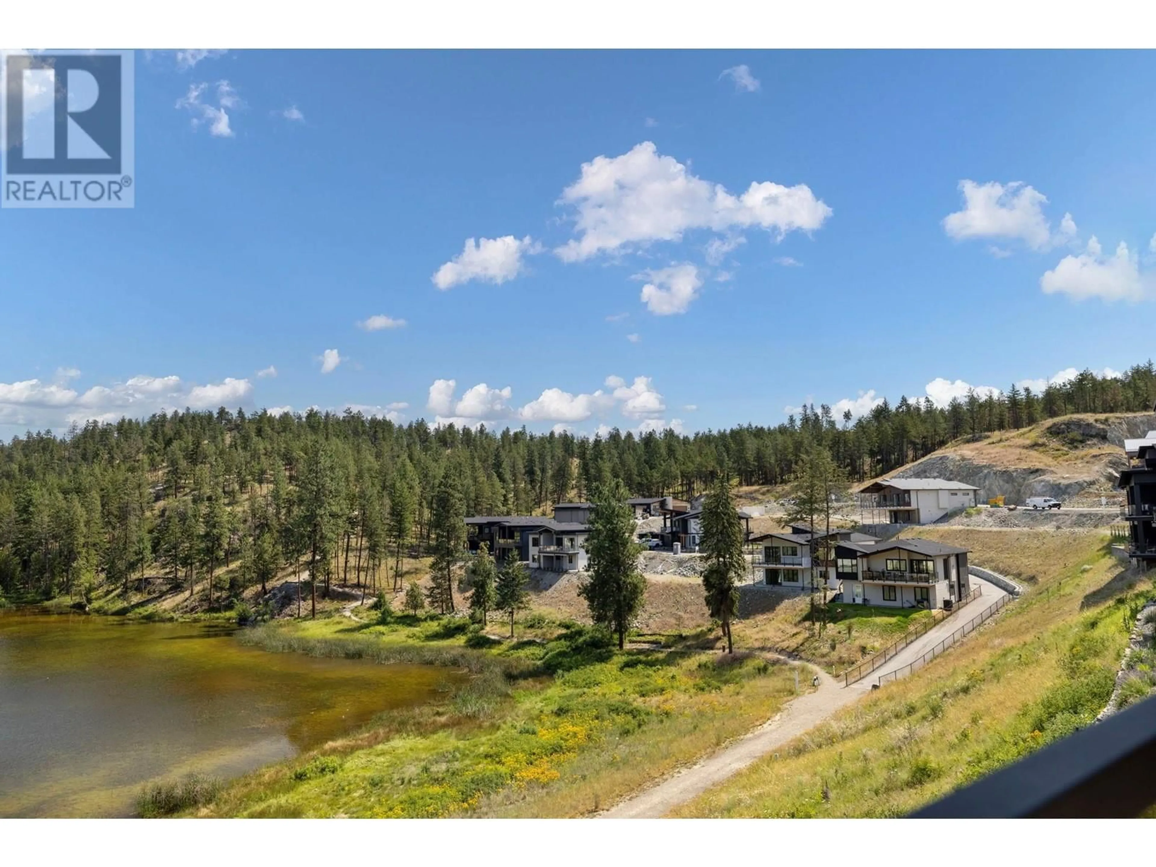 A pic from outside/outdoor area/front of a property/back of a property/a pic from drone, water/lake/river/ocean view for 1888 NORTHERN FLICKER COURT, Kelowna British Columbia V1V0G3