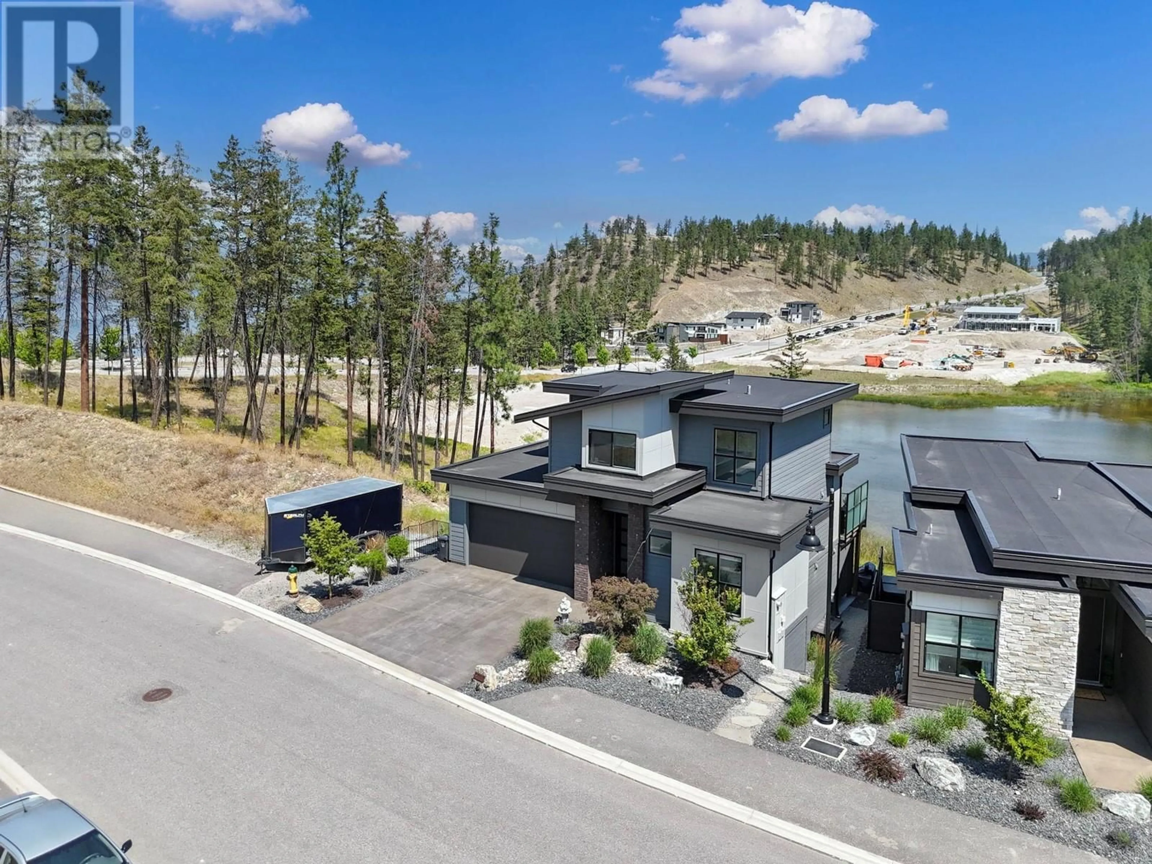 A pic from outside/outdoor area/front of a property/back of a property/a pic from drone, mountain view for 1888 NORTHERN FLICKER COURT, Kelowna British Columbia V1V0G3