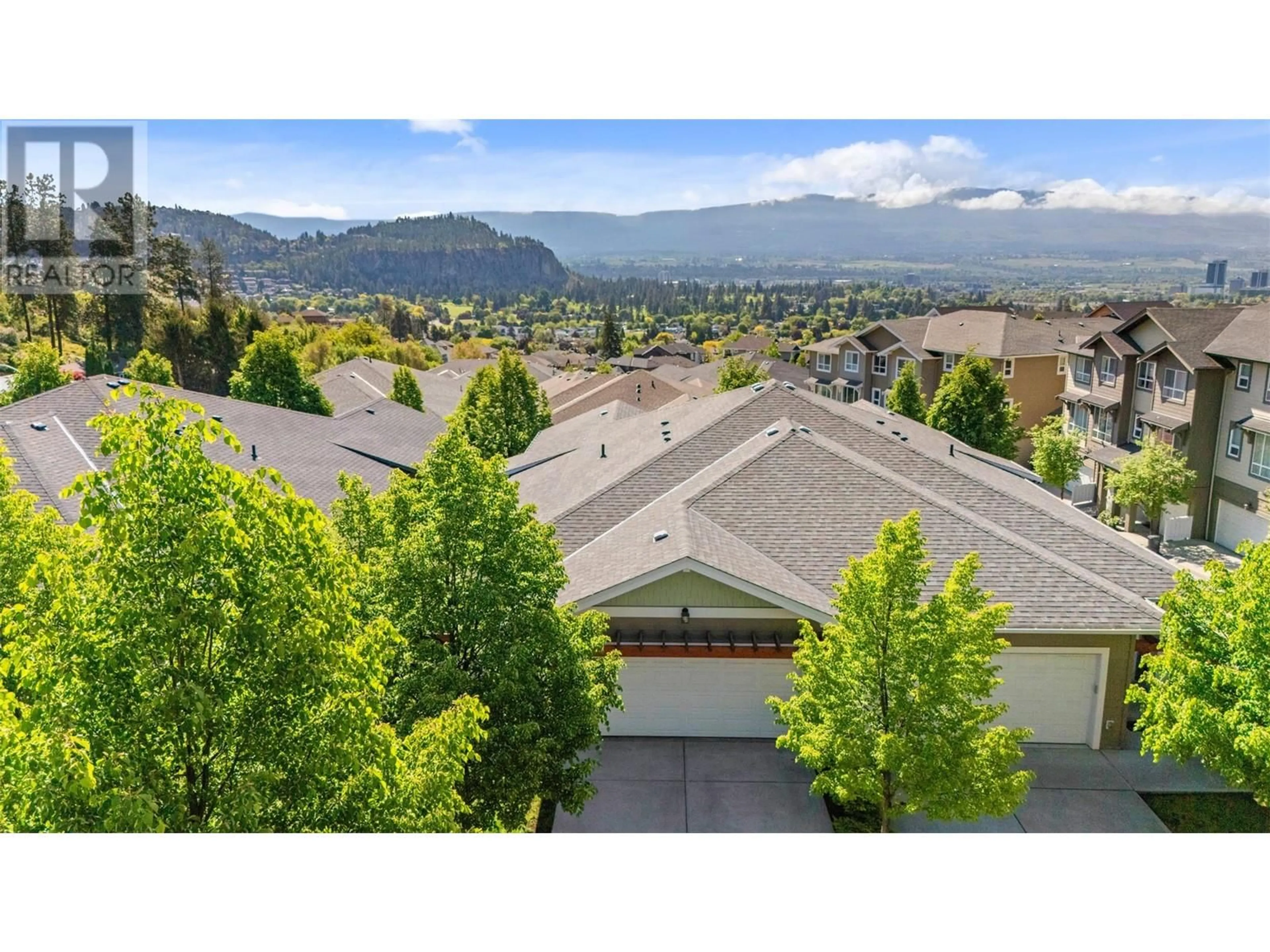 A pic from outside/outdoor area/front of a property/back of a property/a pic from drone, mountain view for 30 - 625 BOYNTON PLACE, Kelowna British Columbia V1V3B5