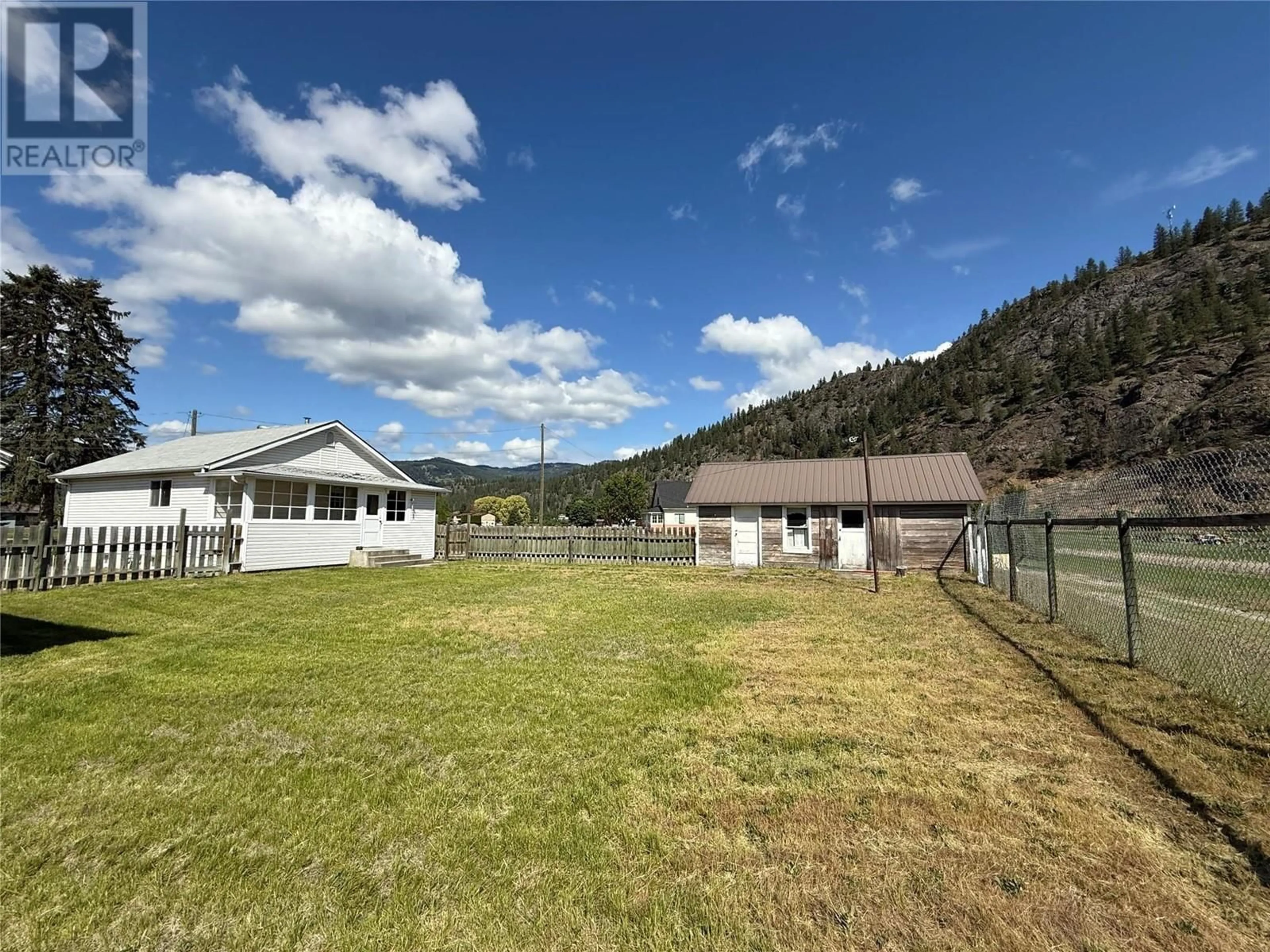 A pic from outside/outdoor area/front of a property/back of a property/a pic from drone, mountain view for 7556 10TH STREET, Grand Forks British Columbia V0H1H0