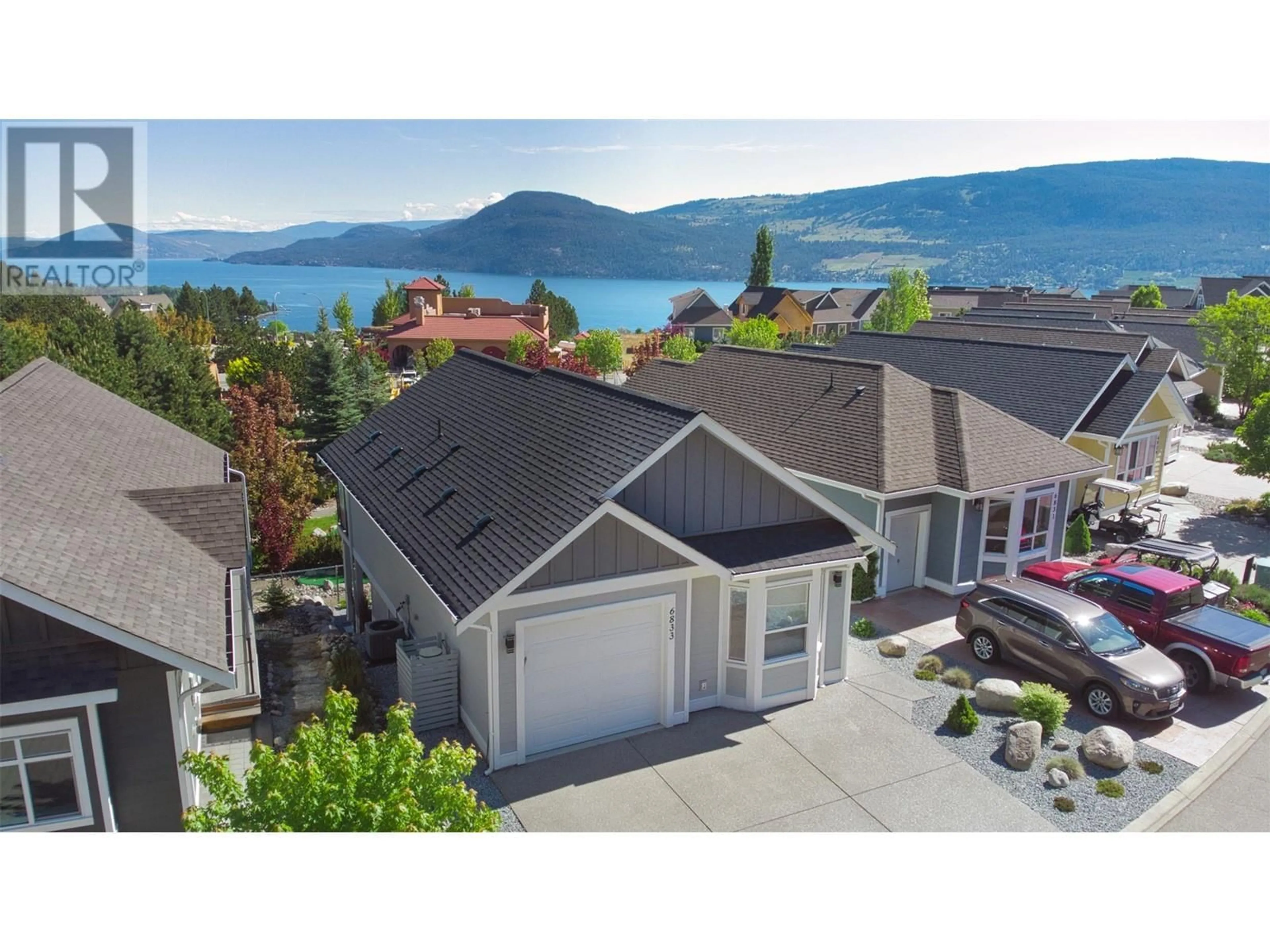 A pic from outside/outdoor area/front of a property/back of a property/a pic from drone, water/lake/river/ocean view for 348 - 6833 MADRID WAY, Kelowna British Columbia V1Z3R8