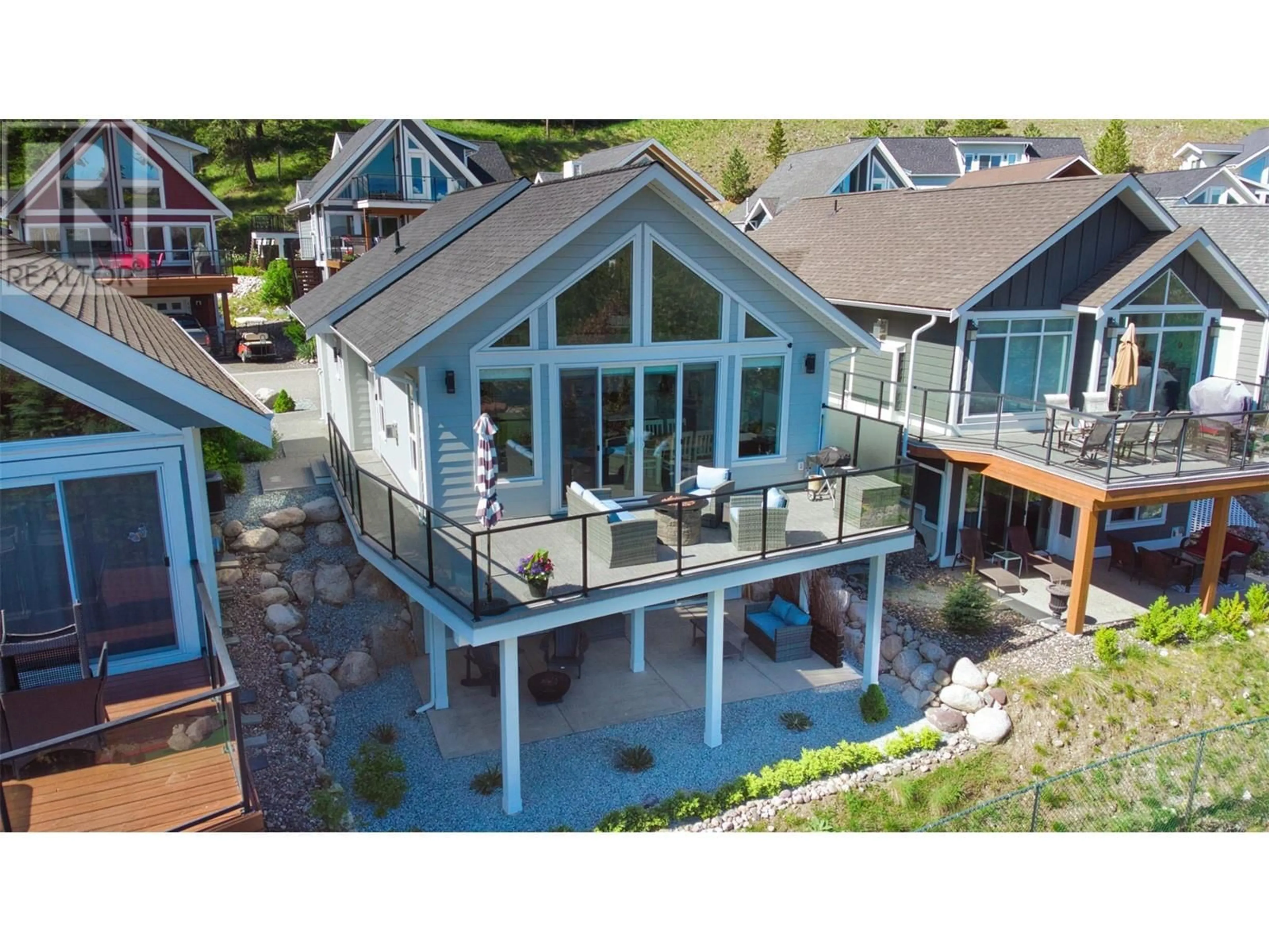 A pic from outside/outdoor area/front of a property/back of a property/a pic from drone, water/lake/river/ocean view for 348 - 6833 MADRID WAY, Kelowna British Columbia V1Z3R8