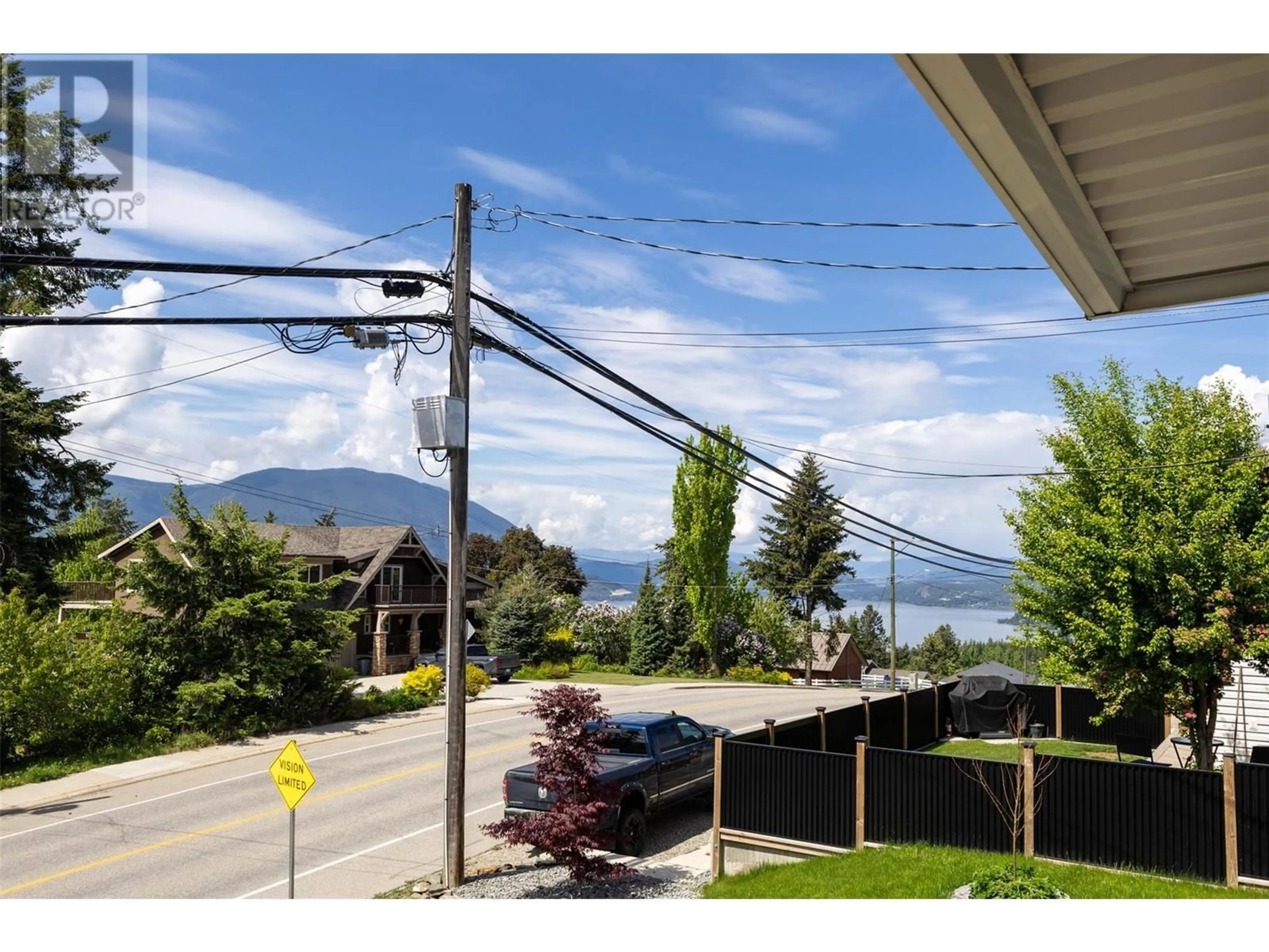 A pic from outside/outdoor area/front of a property/back of a property/a pic from drone, mountain view for 590 20 STREET SOUTHEAST, Salmon Arm British Columbia V1E2J8
