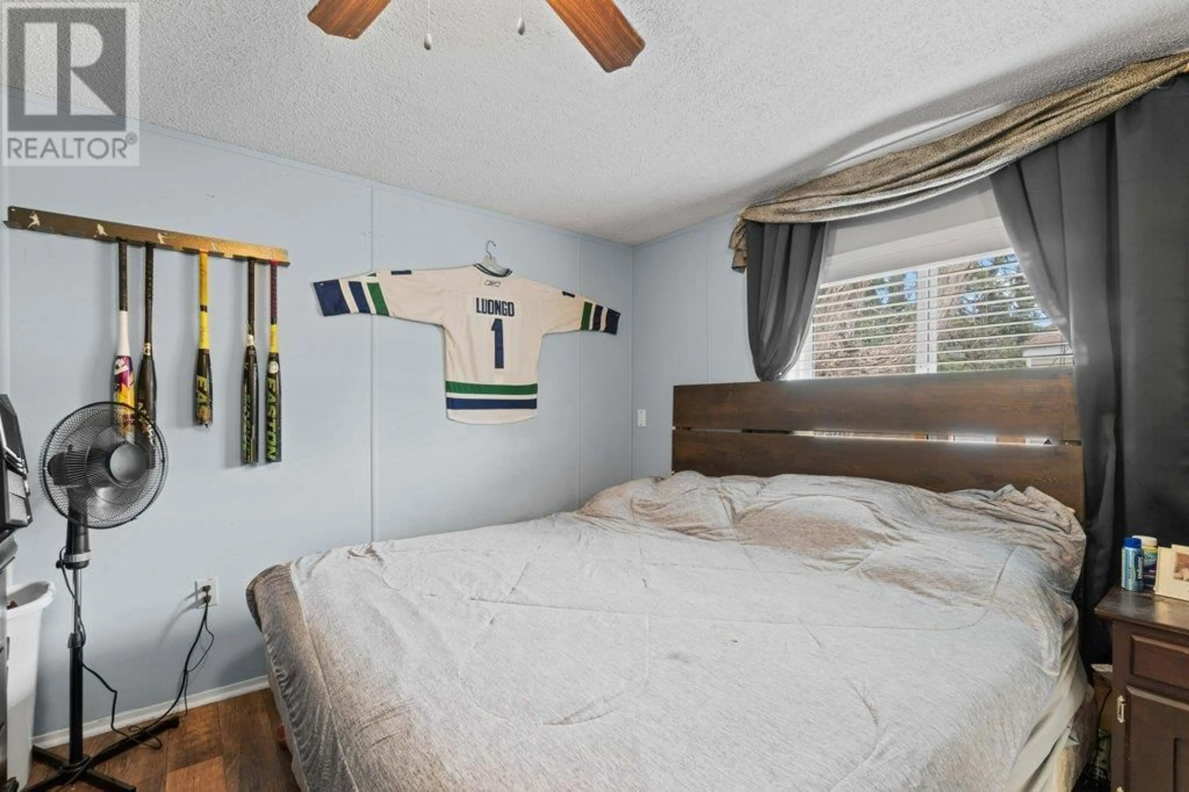Bedroom with bed, wood/laminate floor for 6751 51 STREET NORTHEAST, Salmon Arm British Columbia V0E1K0