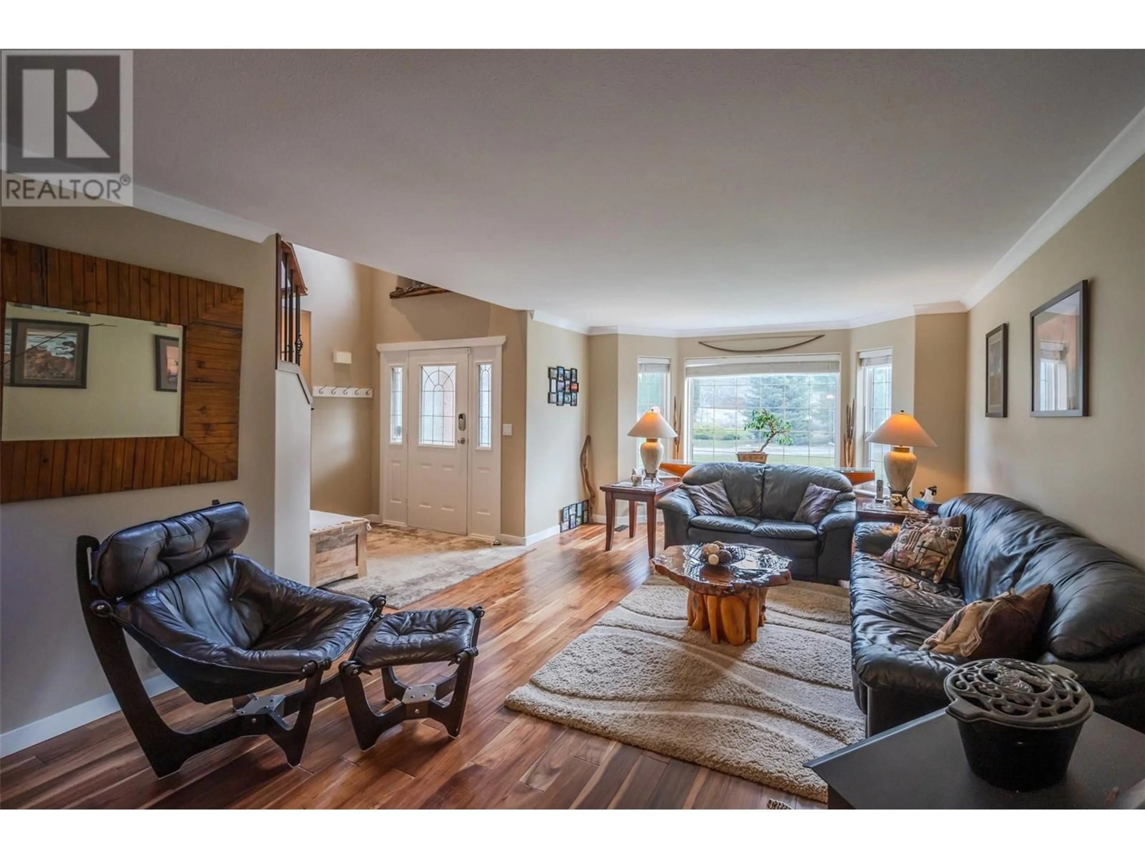 Living room with furniture, wood/laminate floor for 16612 GARNET VALLEY ROAD, Summerland British Columbia V0H1Z3