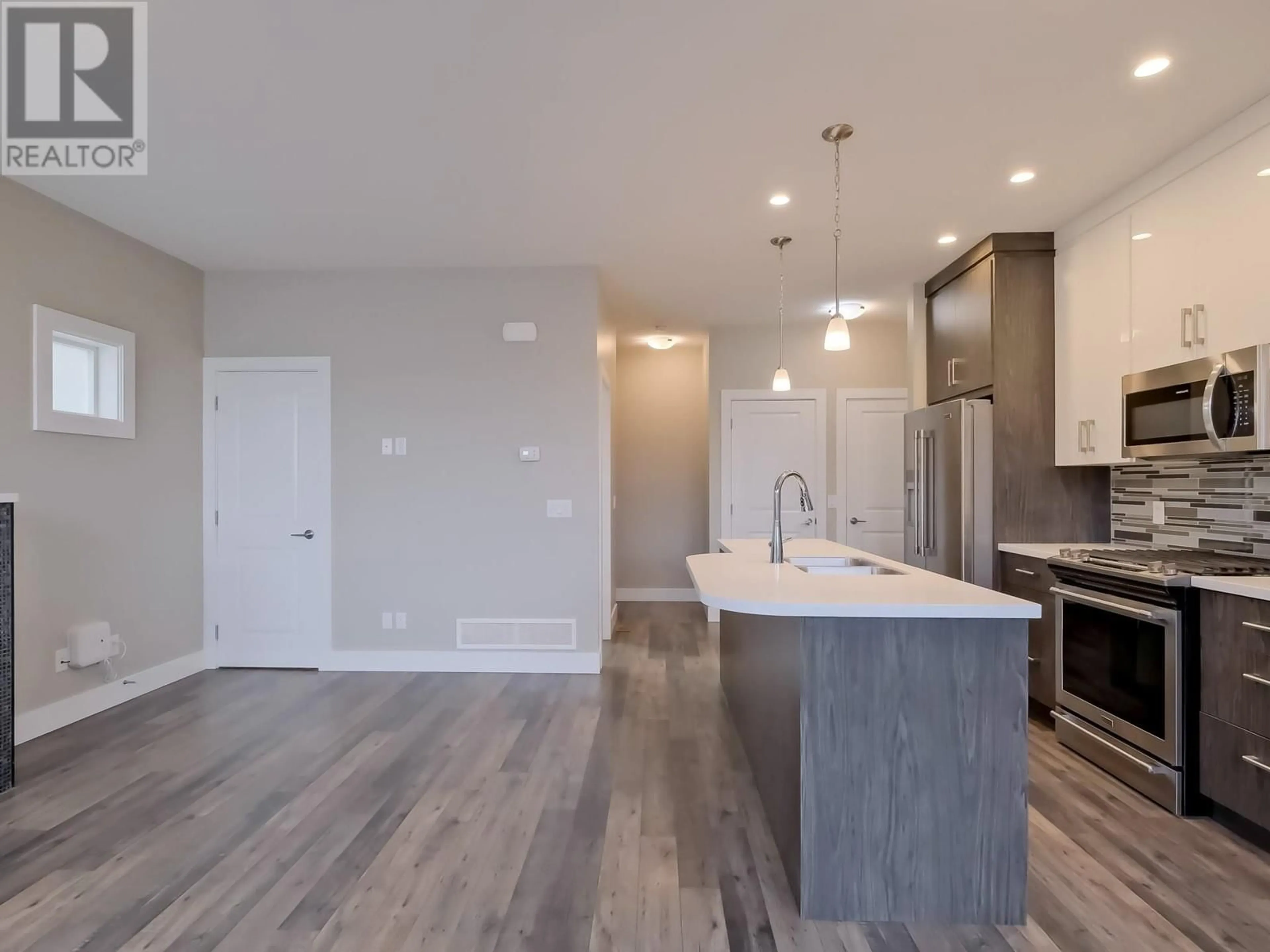 Open concept kitchen, unknown for 102 - 704 REVELSTOKE AVENUE, Penticton British Columbia V2A2J2