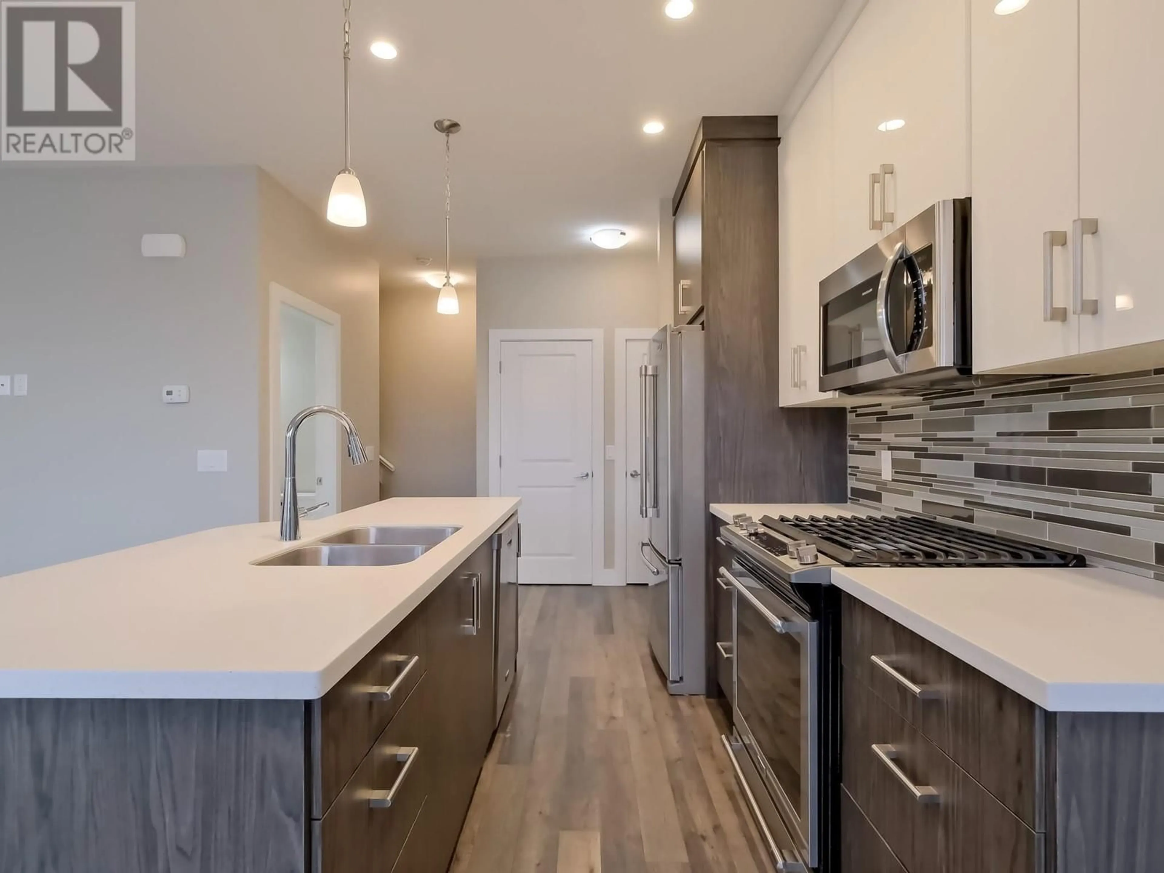 Open concept kitchen, unknown for 102 - 704 REVELSTOKE AVENUE, Penticton British Columbia V2A2J2