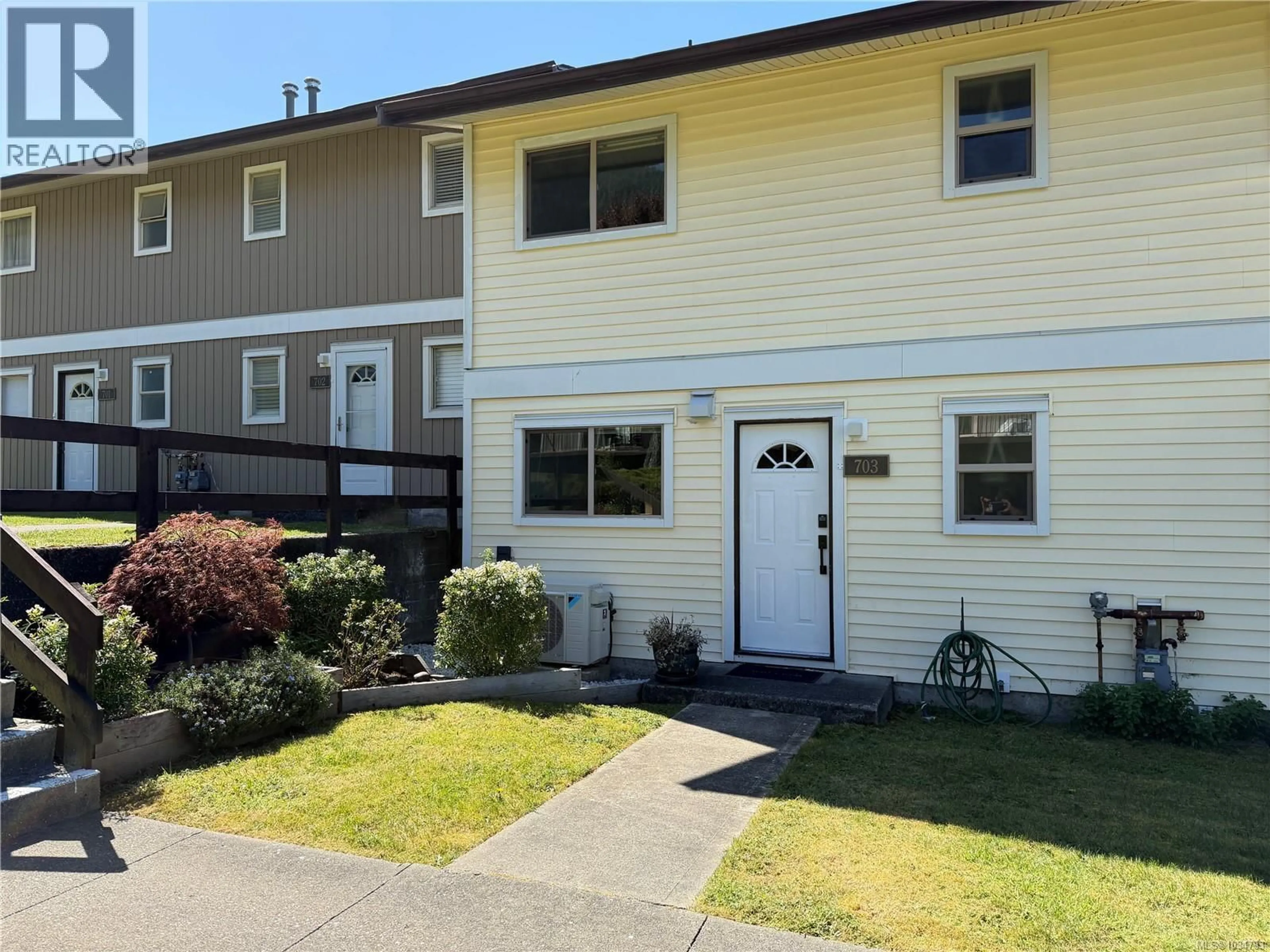 Home with vinyl exterior material, street for 703 NIGEI STREET, Port Alice British Columbia V0N2N0