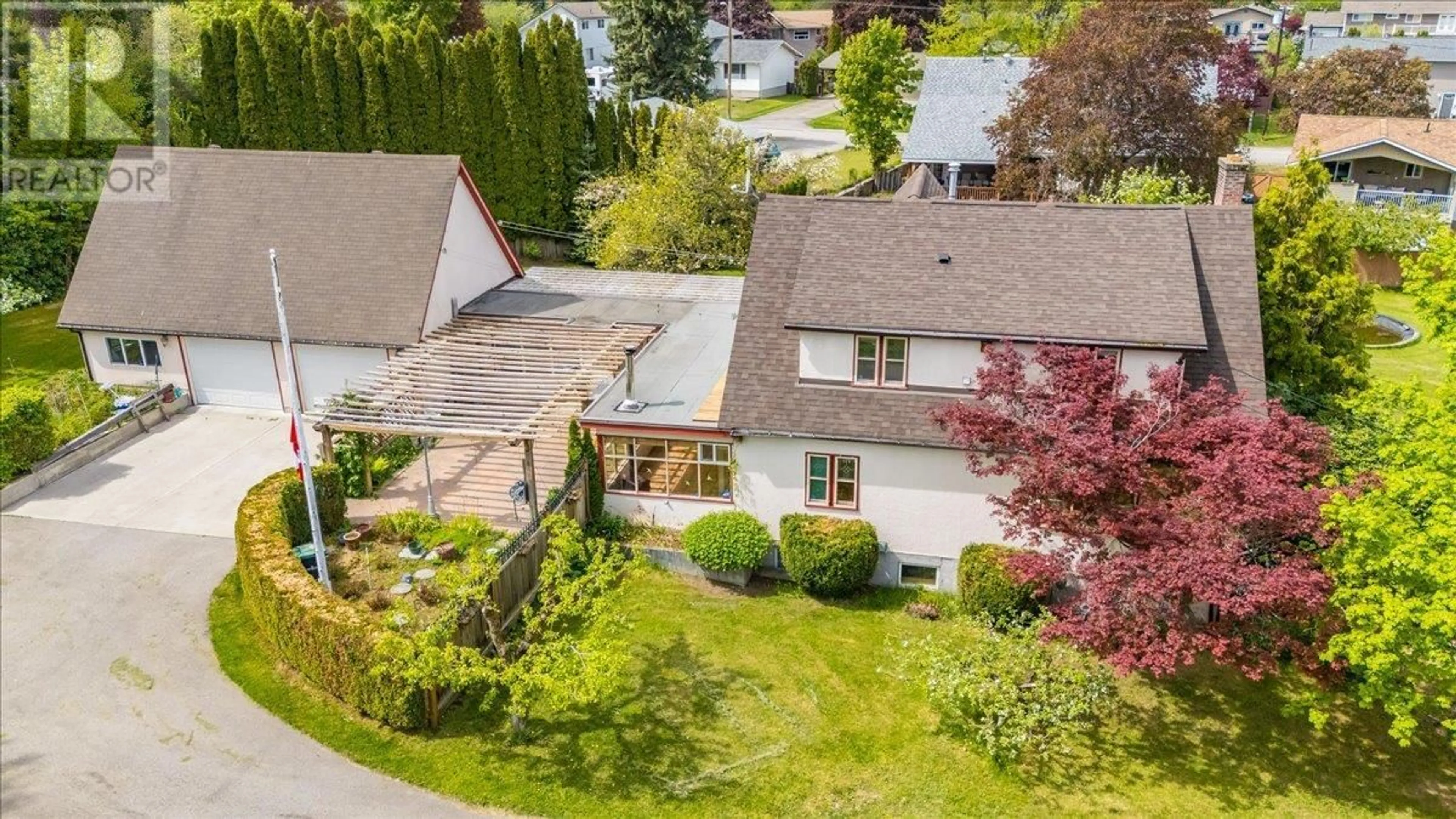 A pic from outside/outdoor area/front of a property/back of a property/a pic from drone, street for 102 18TH STREET, Castlegar British Columbia V1N2M7