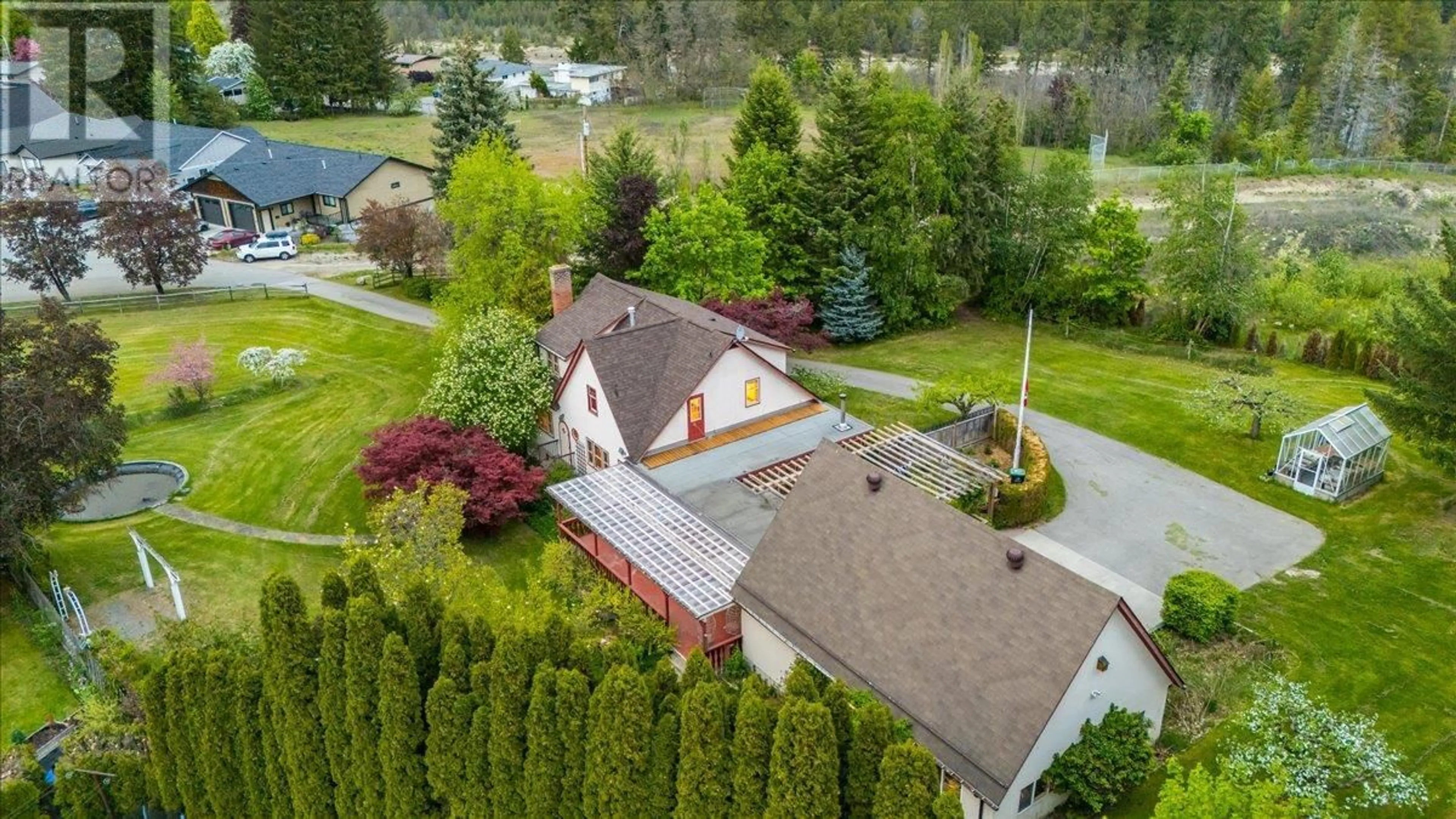A pic from outside/outdoor area/front of a property/back of a property/a pic from drone, street for 102 18TH STREET, Castlegar British Columbia V1N2M7