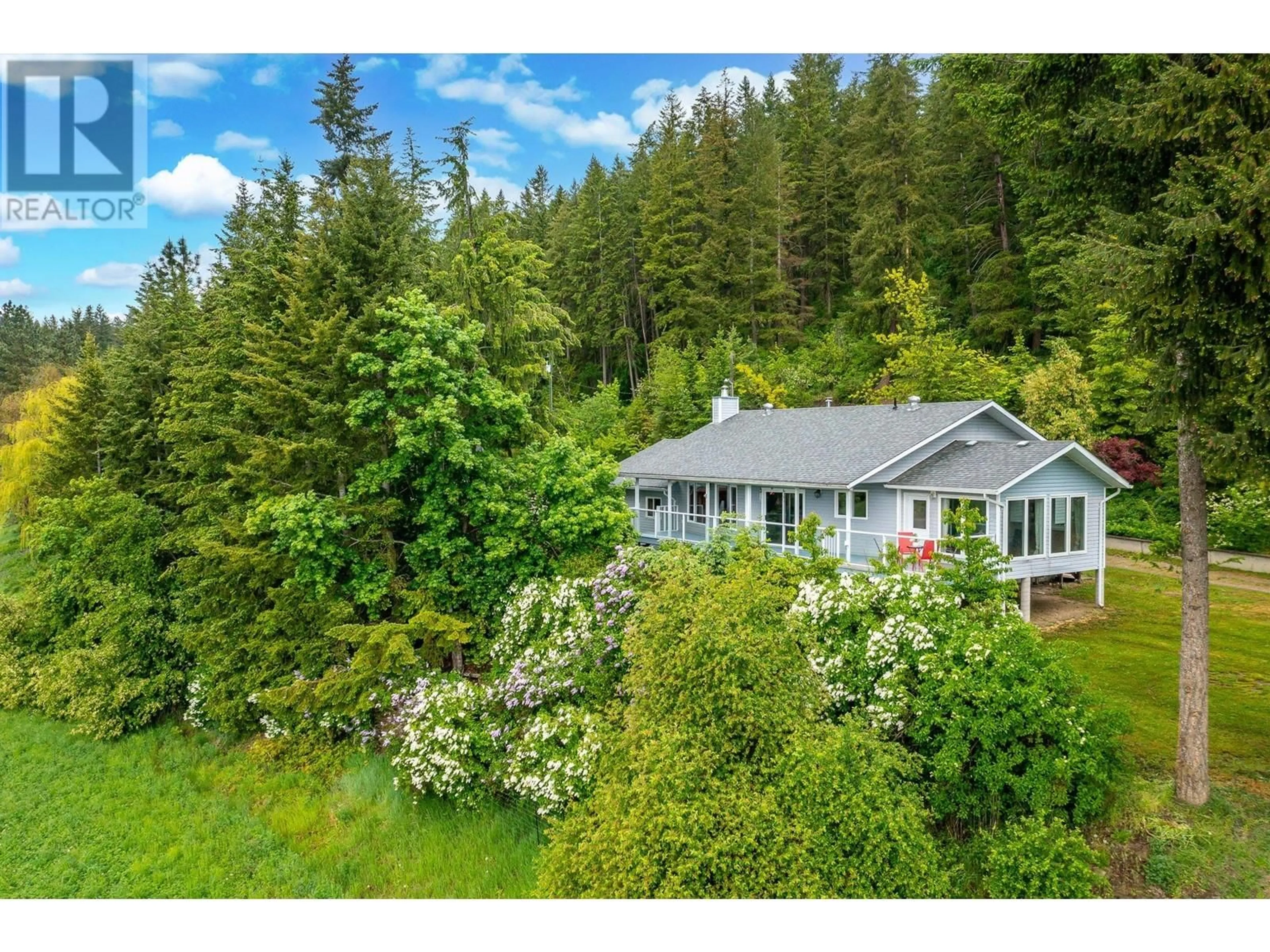 A pic from outside/outdoor area/front of a property/back of a property/a pic from drone, forest/trees view for 167 BRASH-ALLEN ROAD, Enderby British Columbia V0E1V4
