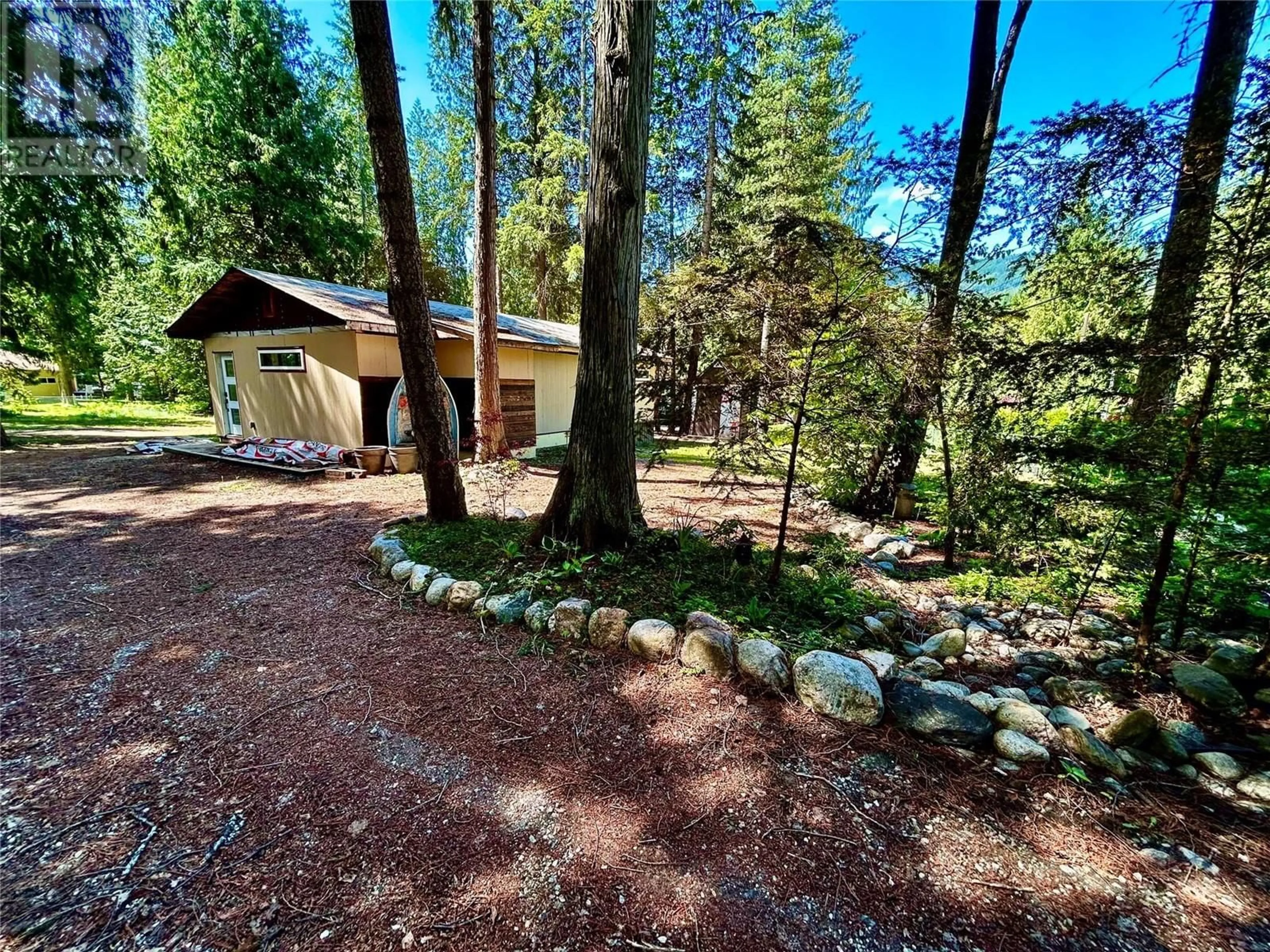 A pic from outside/outdoor area/front of a property/back of a property/a pic from drone, forest/trees view for 650 SWANSEA POINT ROAD, Swansea Point British Columbia V0E2K2