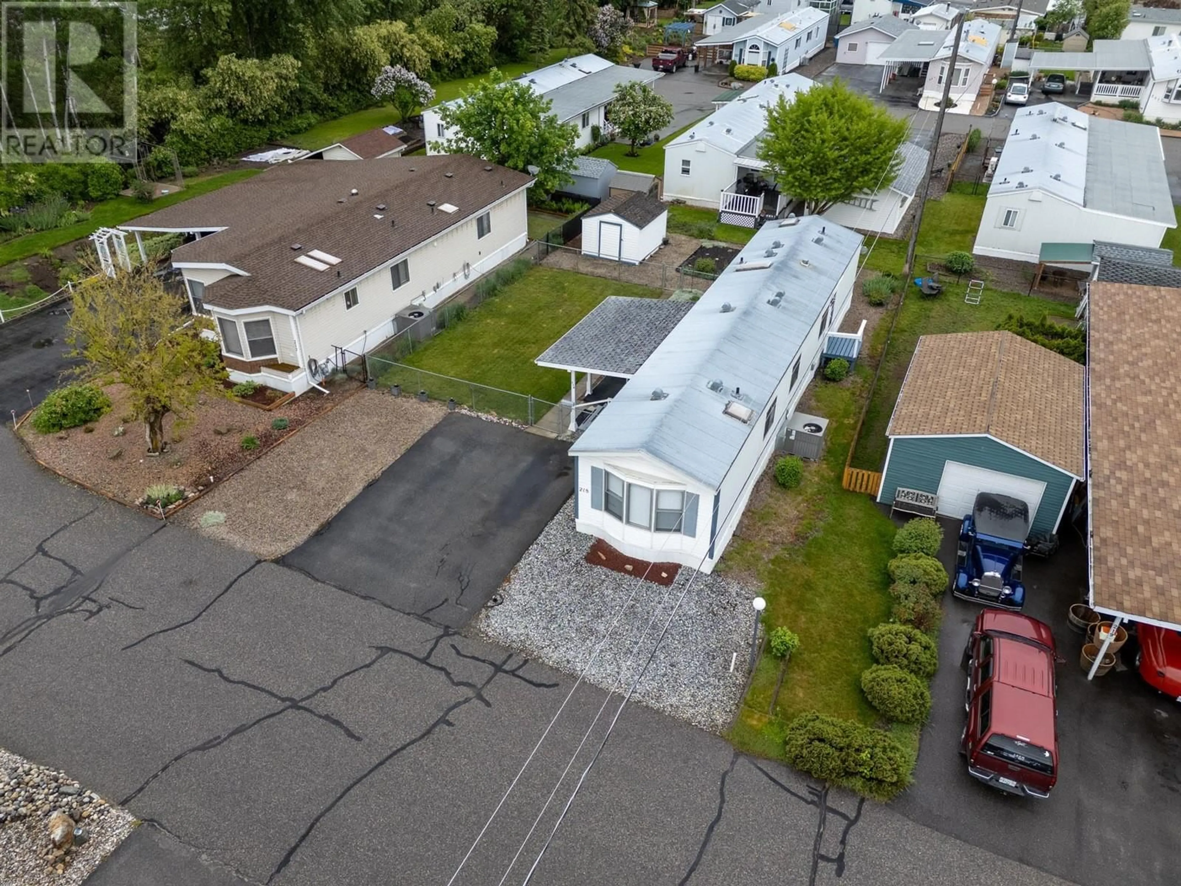 A pic from outside/outdoor area/front of a property/back of a property/a pic from drone, street for 218 - 720 COMMONWEALTH ROAD, Kelowna British Columbia V4V1S2