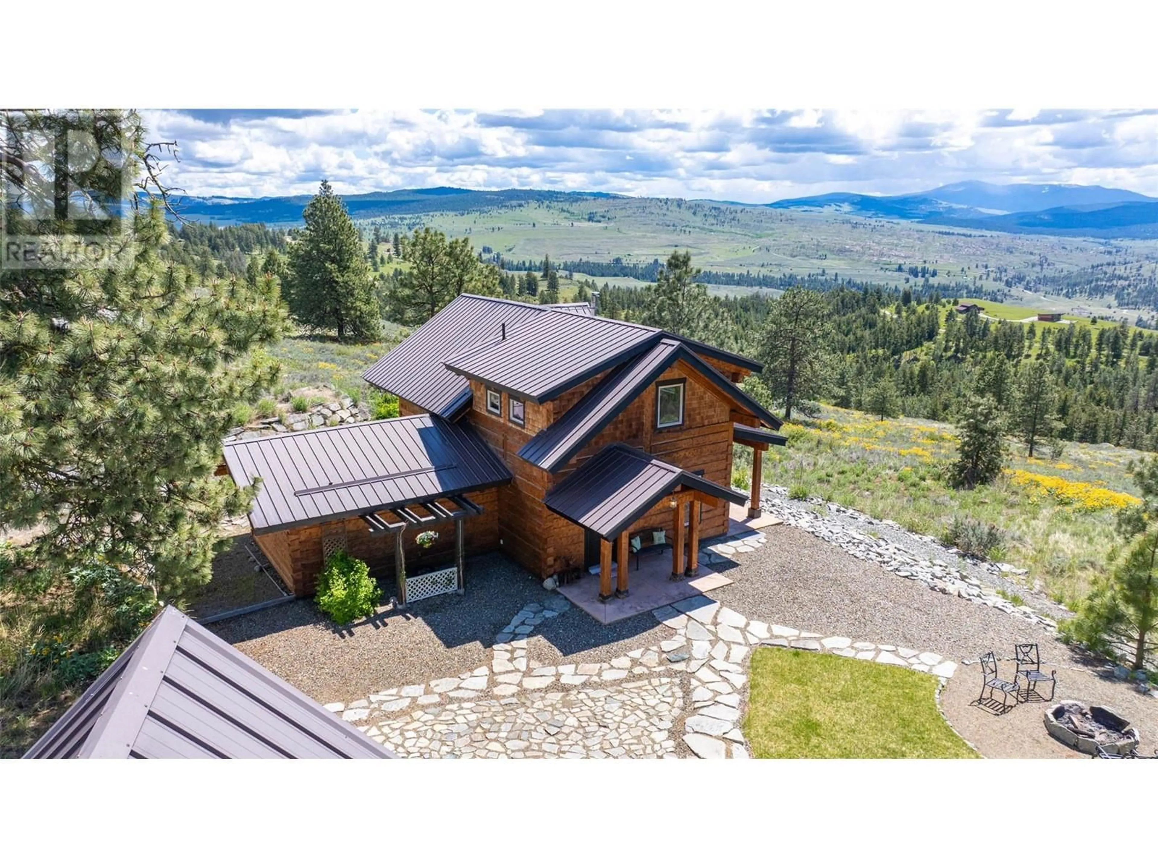 A pic from outside/outdoor area/front of a property/back of a property/a pic from drone, mountain view for 137 CARIBOU POINT, Osoyoos British Columbia V0H1V6