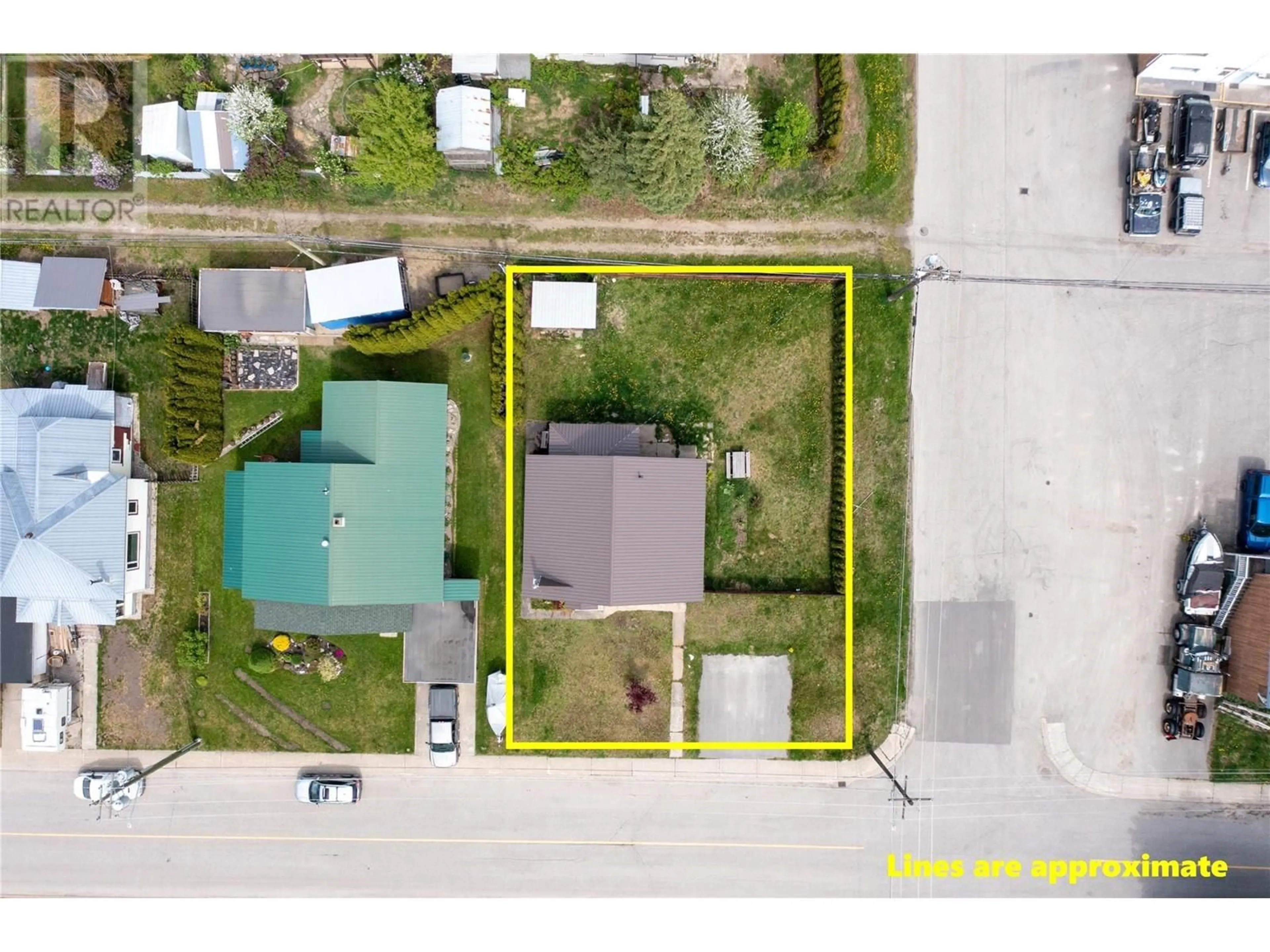 A pic from outside/outdoor area/front of a property/back of a property/a pic from drone, street for 1102 SECOND STREET WEST, Revelstoke British Columbia V0E2S0