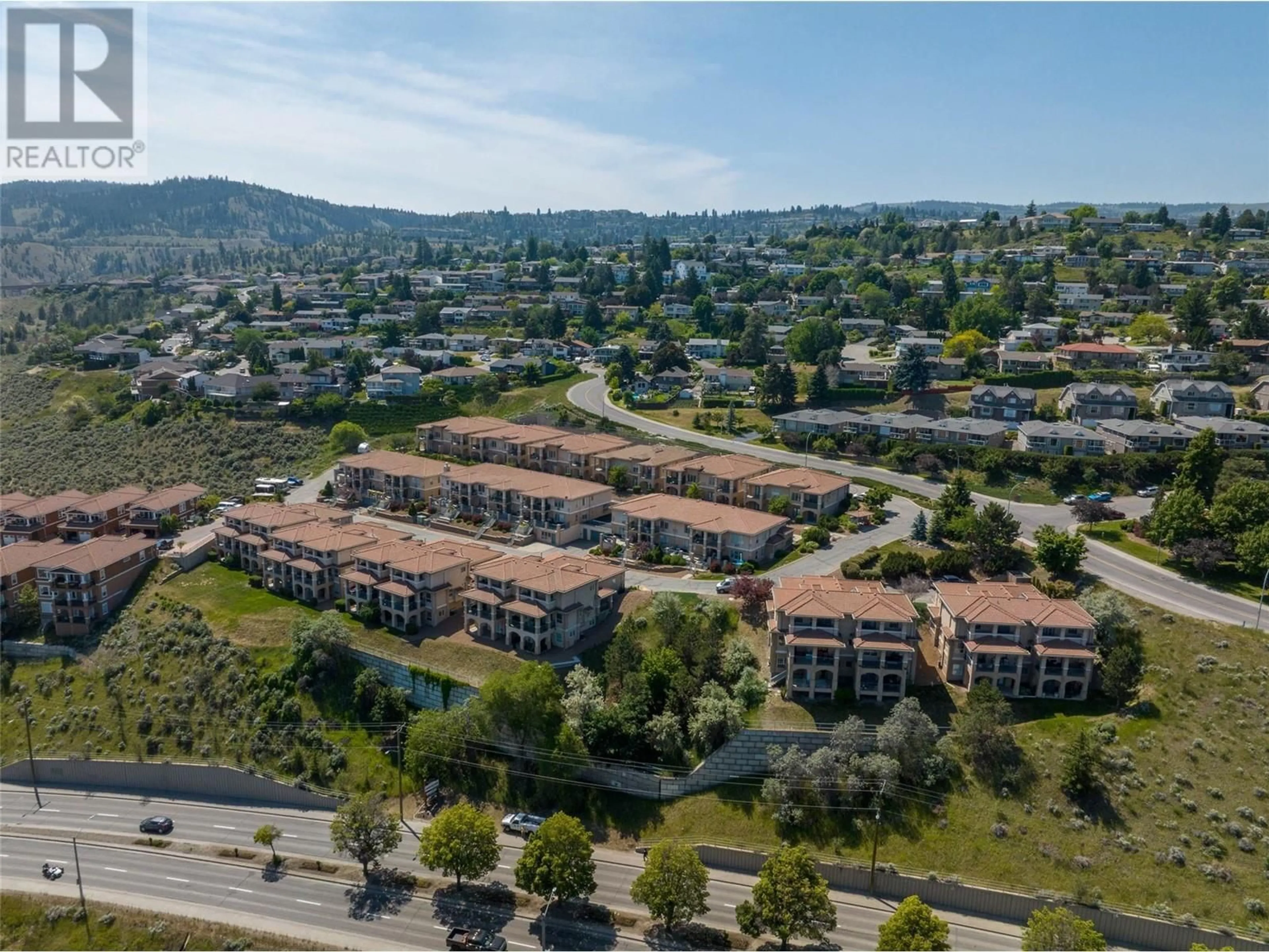 A pic from outside/outdoor area/front of a property/back of a property/a pic from drone, mountain view for 408 - 875 SAHALI TERRACE, Kamloops British Columbia V2C6W8