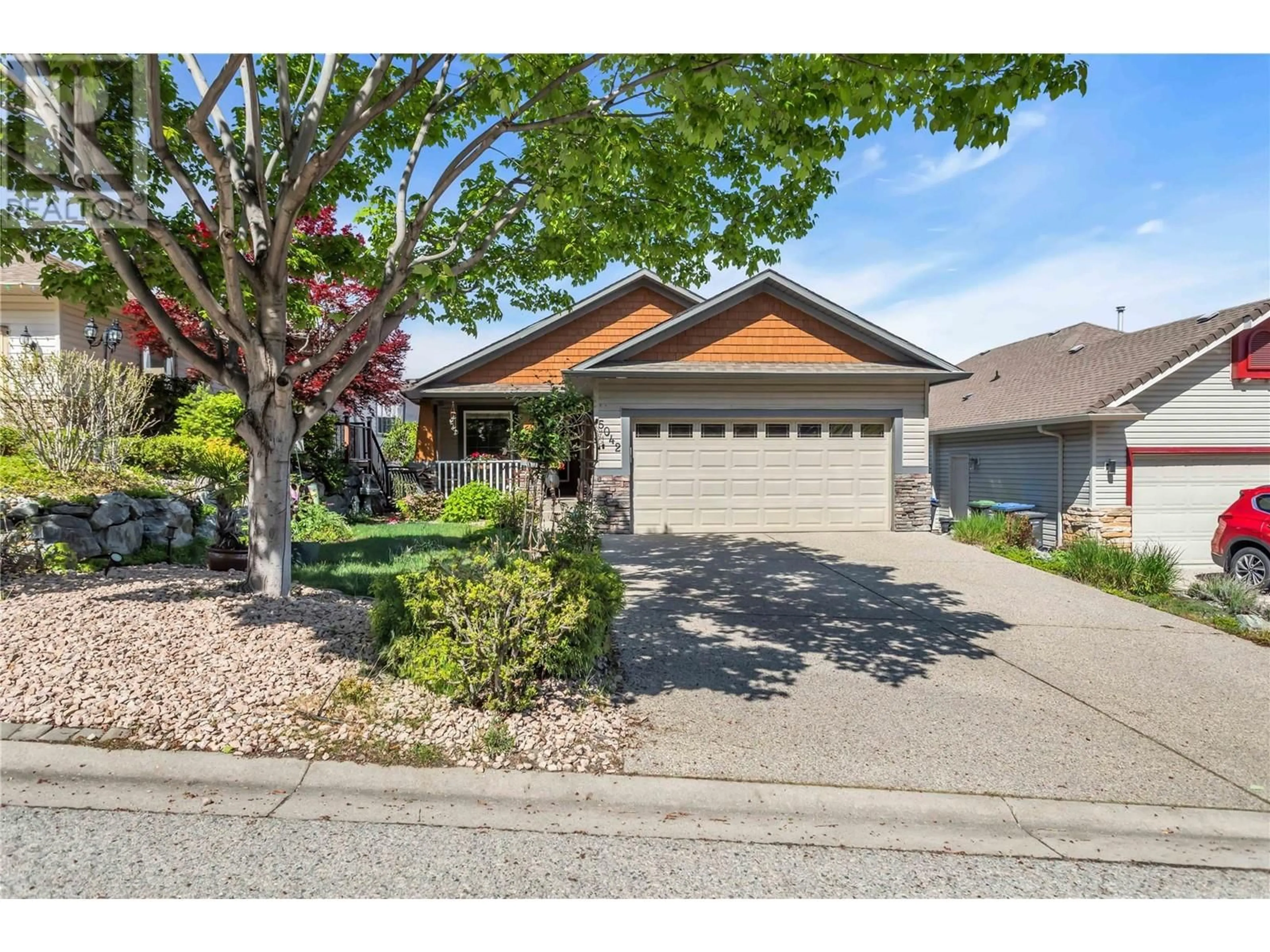 Home with vinyl exterior material, street for 5042 SOUTH RIDGE DRIVE, Kelowna British Columbia V1W4W6