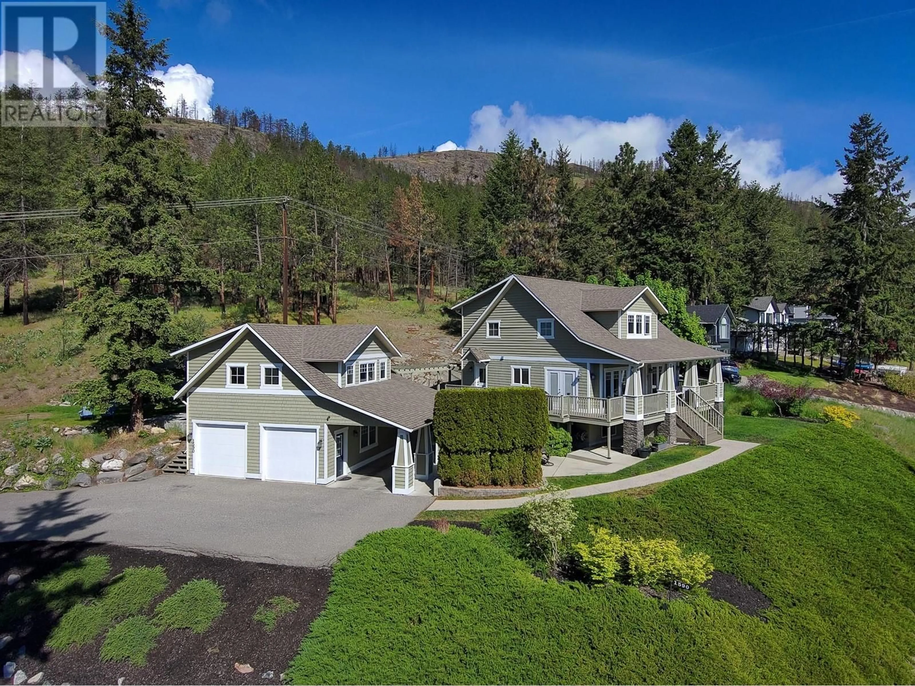 A pic from outside/outdoor area/front of a property/back of a property/a pic from drone, mountain view for 1590 WEST KELOWNA ROAD, West Kelowna British Columbia V1Z3H5