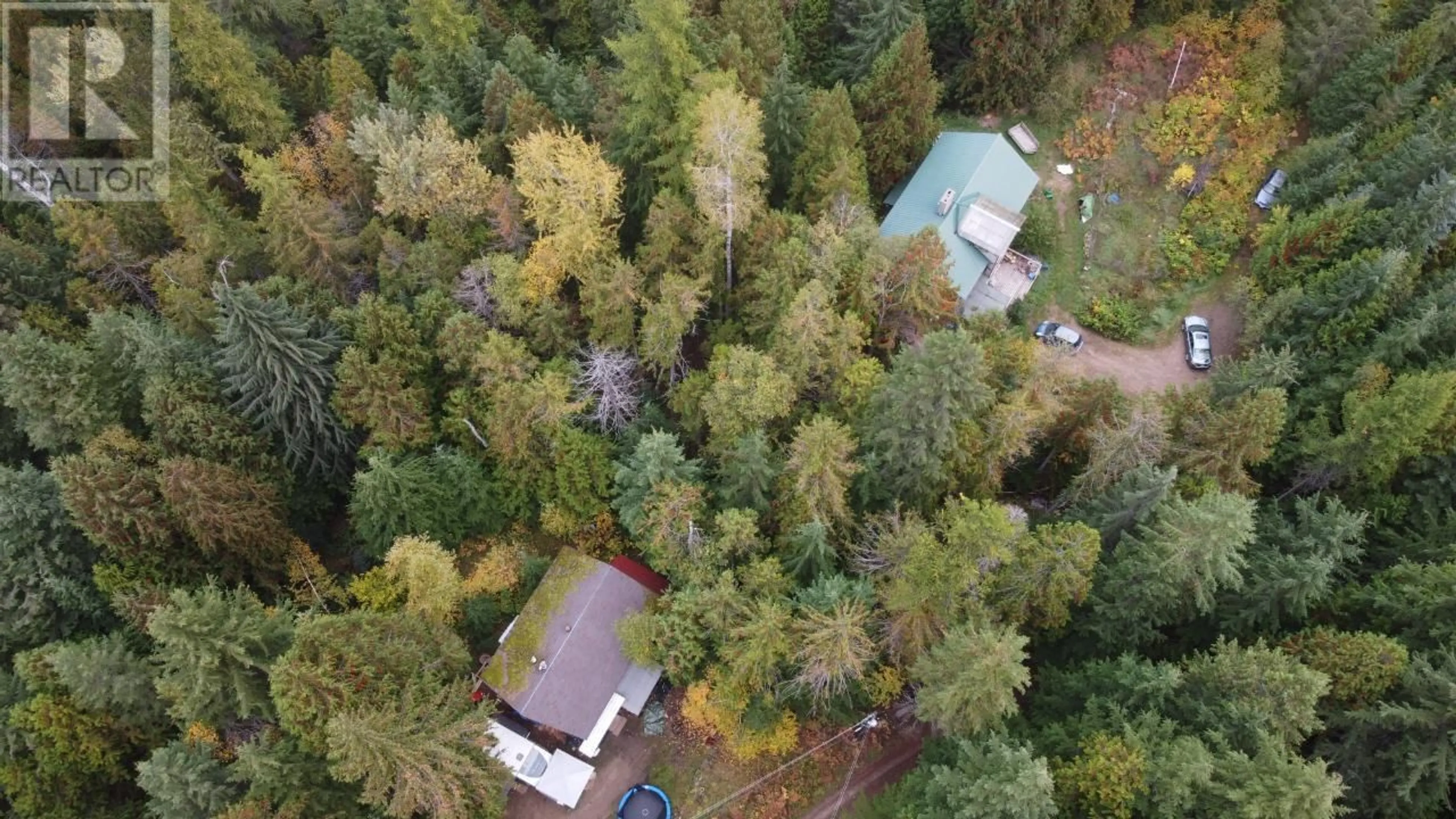A pic from outside/outdoor area/front of a property/back of a property/a pic from drone, forest/trees view for 4820 6 HIGHWAY, Winlaw British Columbia V0G2J0