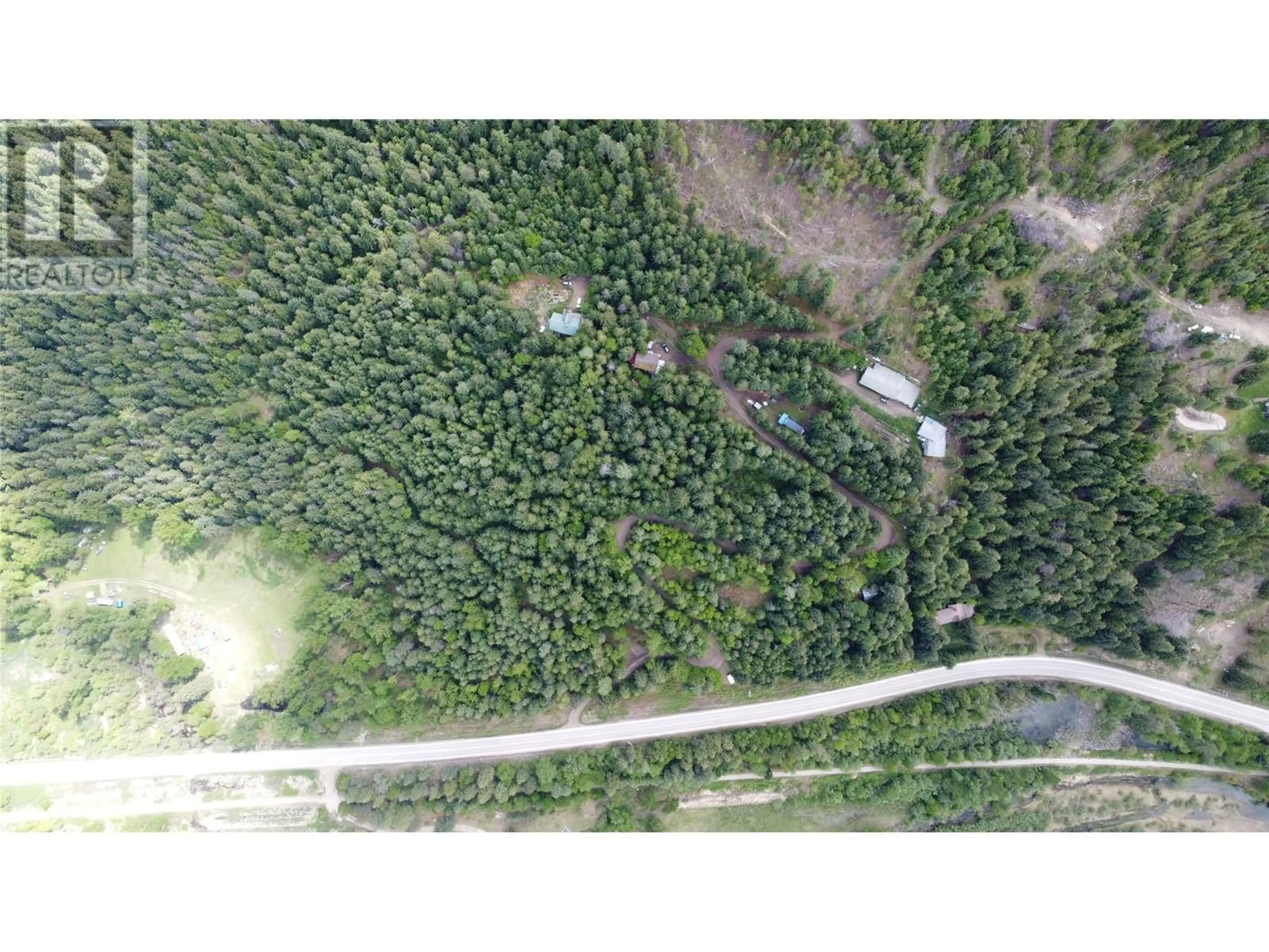 A pic from outside/outdoor area/front of a property/back of a property/a pic from drone, forest/trees view for 4820 6 HIGHWAY, Winlaw British Columbia V0G2J0