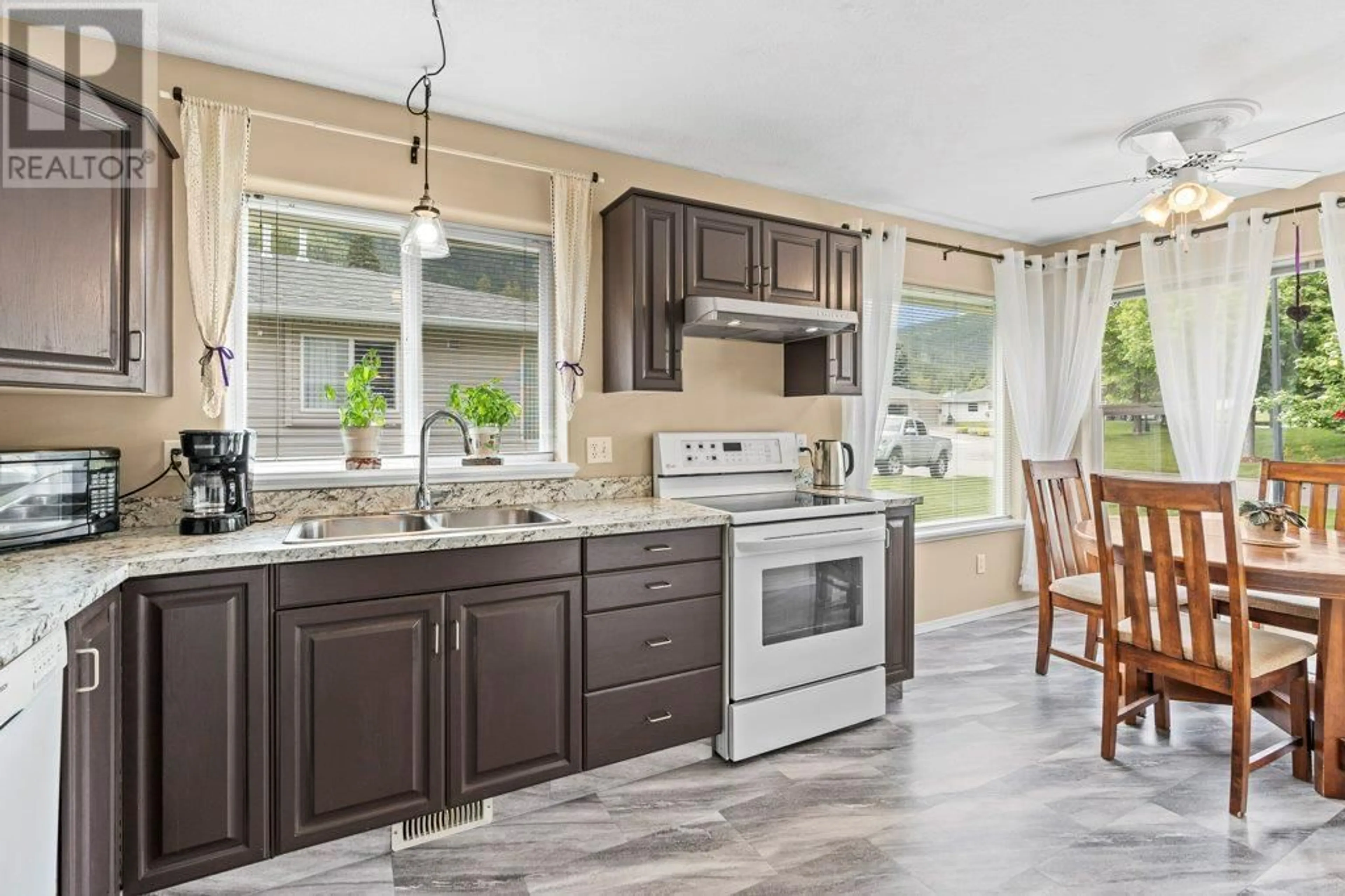 Open concept kitchen, ceramic/tile floor for 14 - 2675 PINE AVENUE, Lumby British Columbia V0E2G5