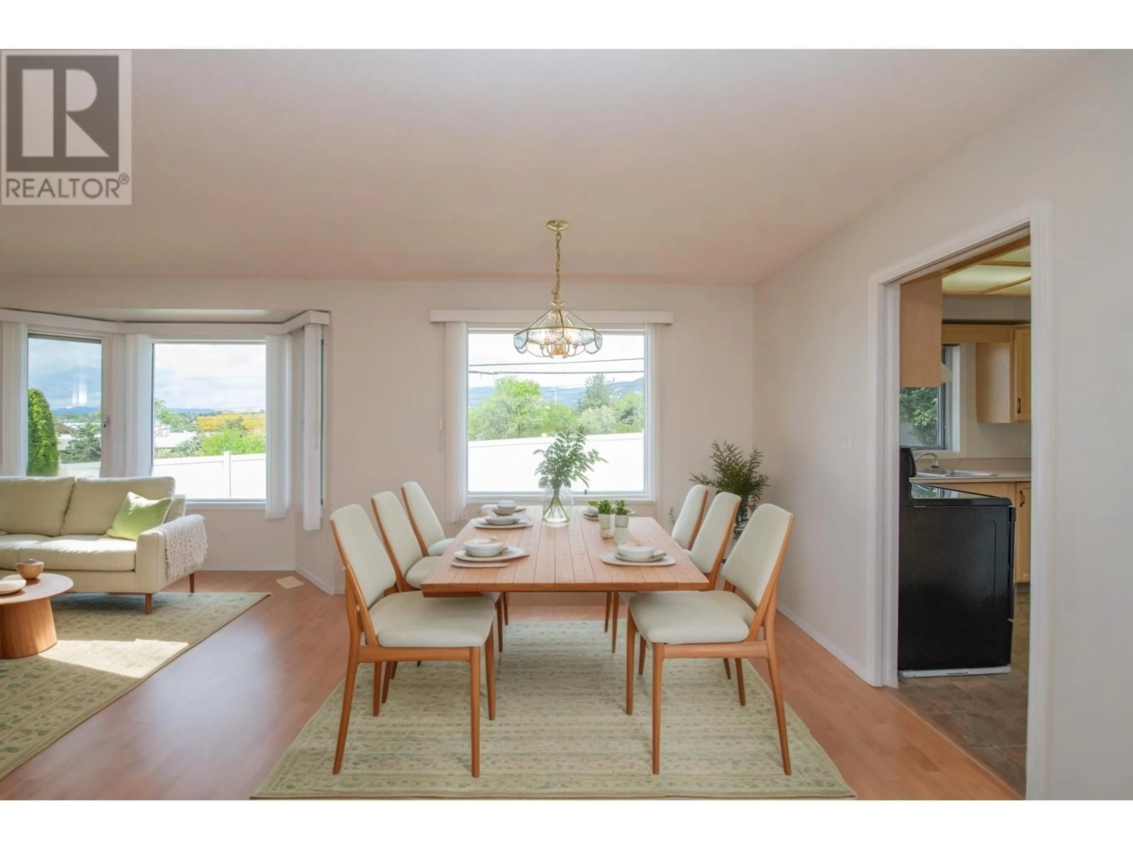 Dining room, wood/laminate floor for 13 - 124 SARSONS ROAD, Vernon British Columbia V1B2T9