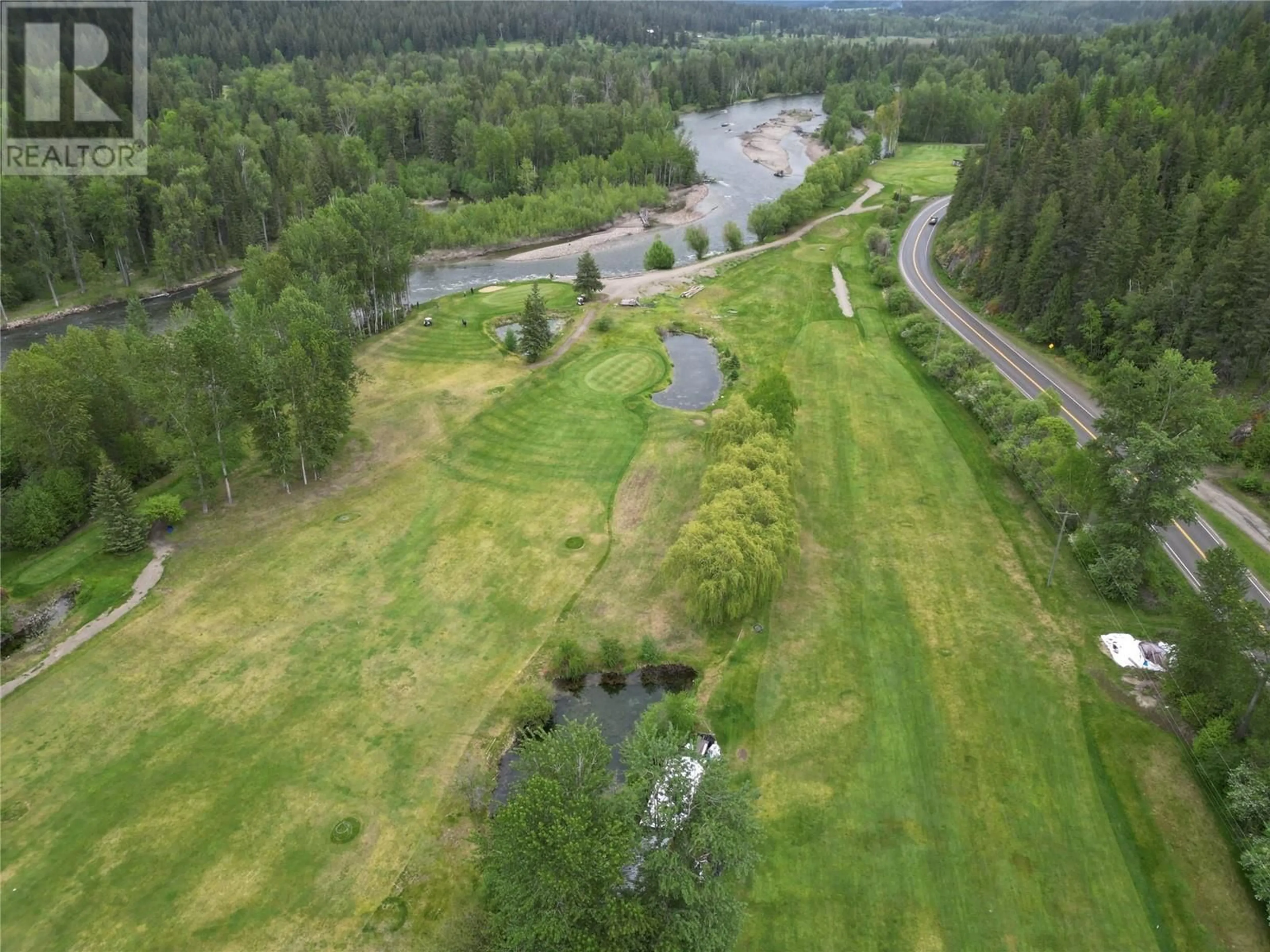 A pic from outside/outdoor area/front of a property/back of a property/a pic from drone, water/lake/river/ocean view for 1361 6 HIGHWAY, Cherryville British Columbia V0E2G1