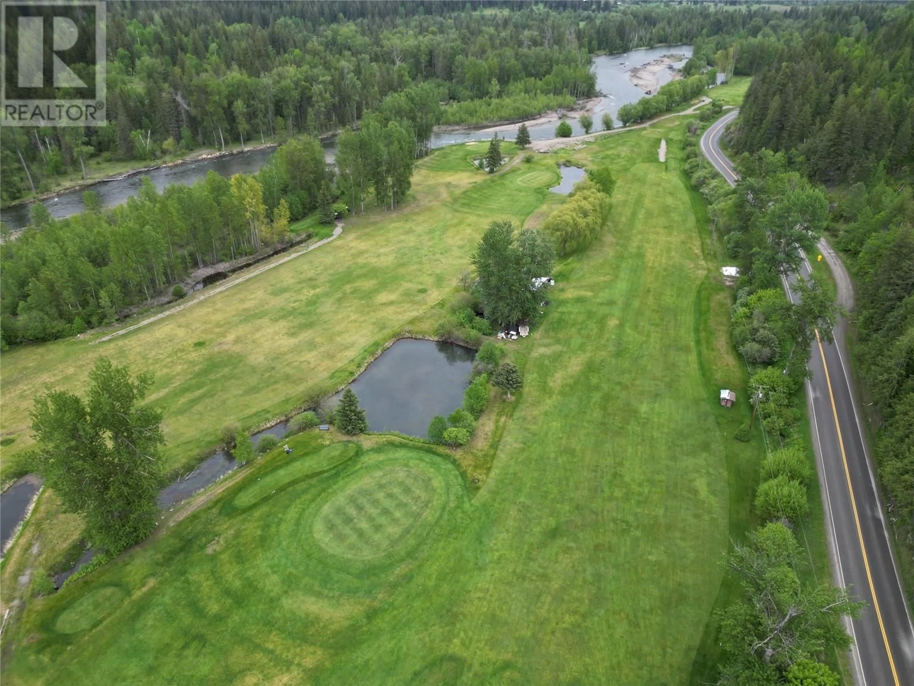 A pic from outside/outdoor area/front of a property/back of a property/a pic from drone, water/lake/river/ocean view for 1361 6 HIGHWAY, Cherryville British Columbia V0E2G1