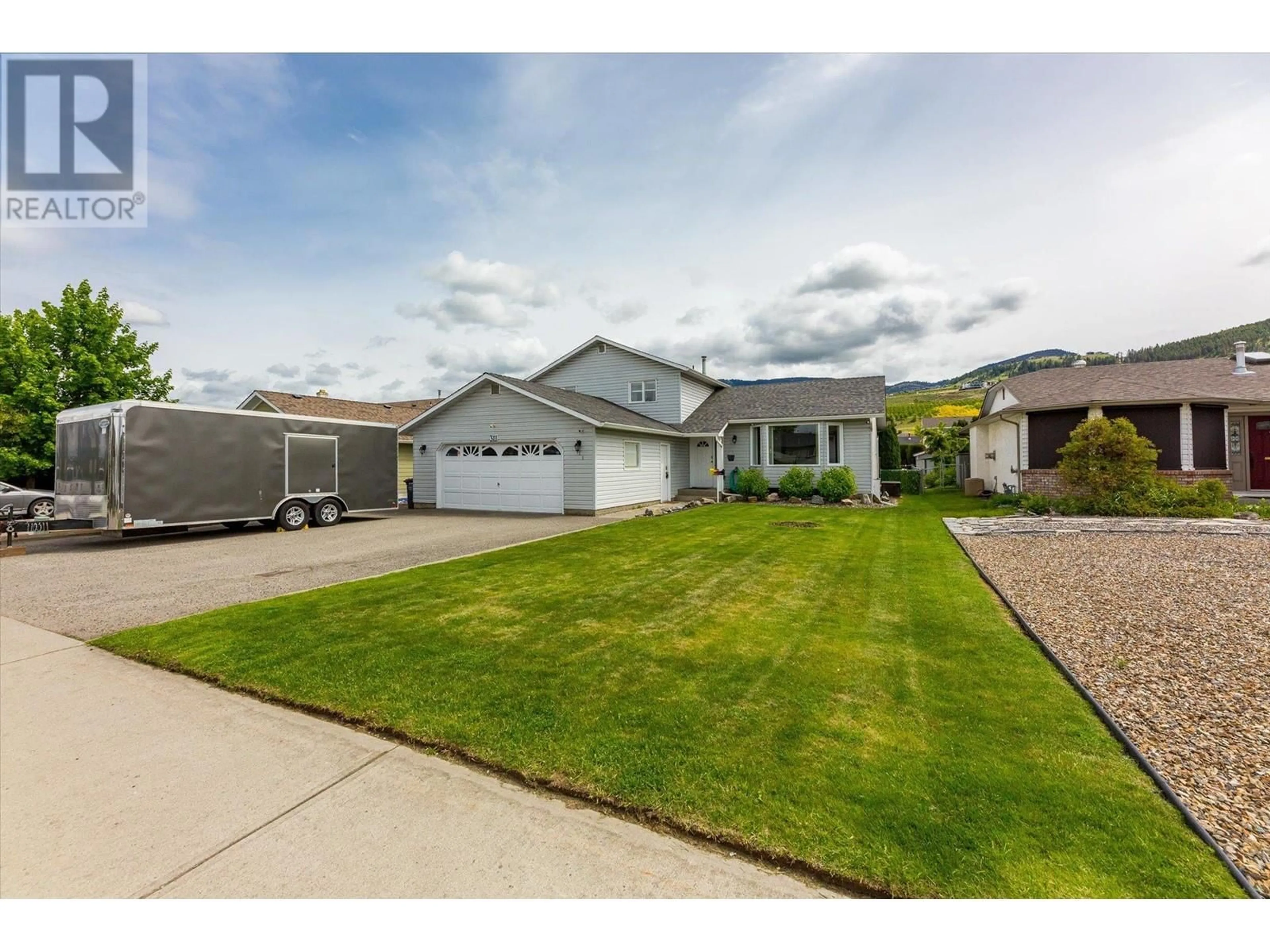 Home with vinyl exterior material, street for 311 MOLNAR ROAD, Kelowna British Columbia V1X7B9