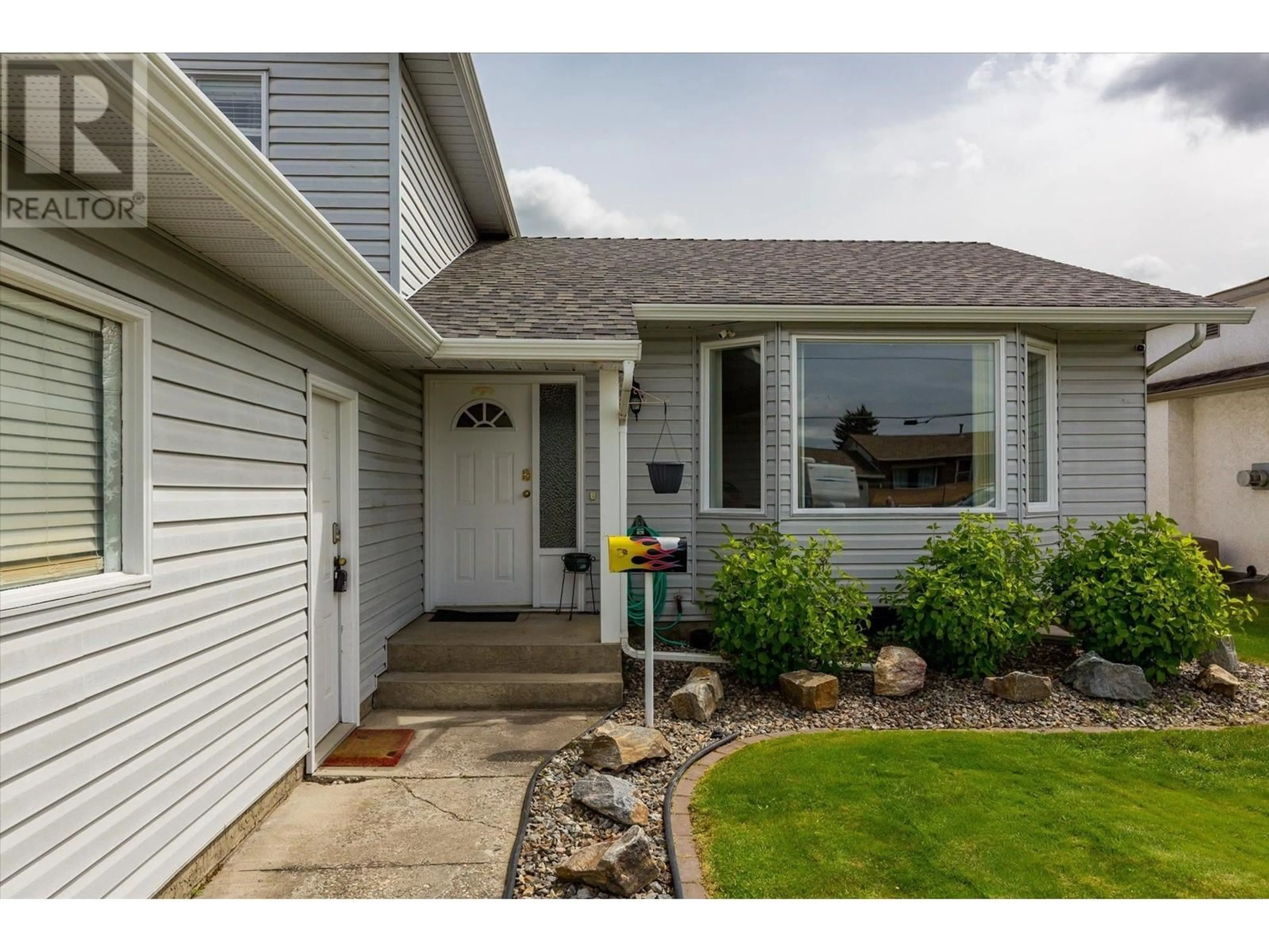 Home with vinyl exterior material, street for 311 MOLNAR ROAD, Kelowna British Columbia V1X7B9