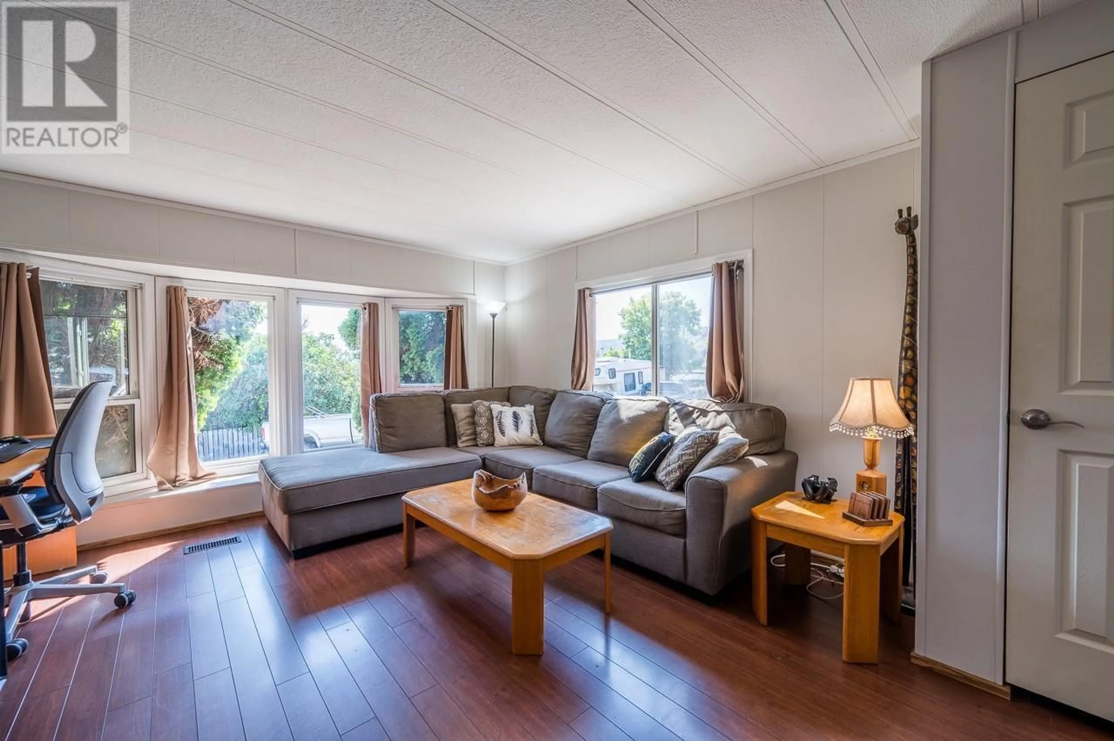 Living room with furniture, wood/laminate floor for C6 - 7155 DALLAS DRIVE, Kamloops British Columbia V2C4T1