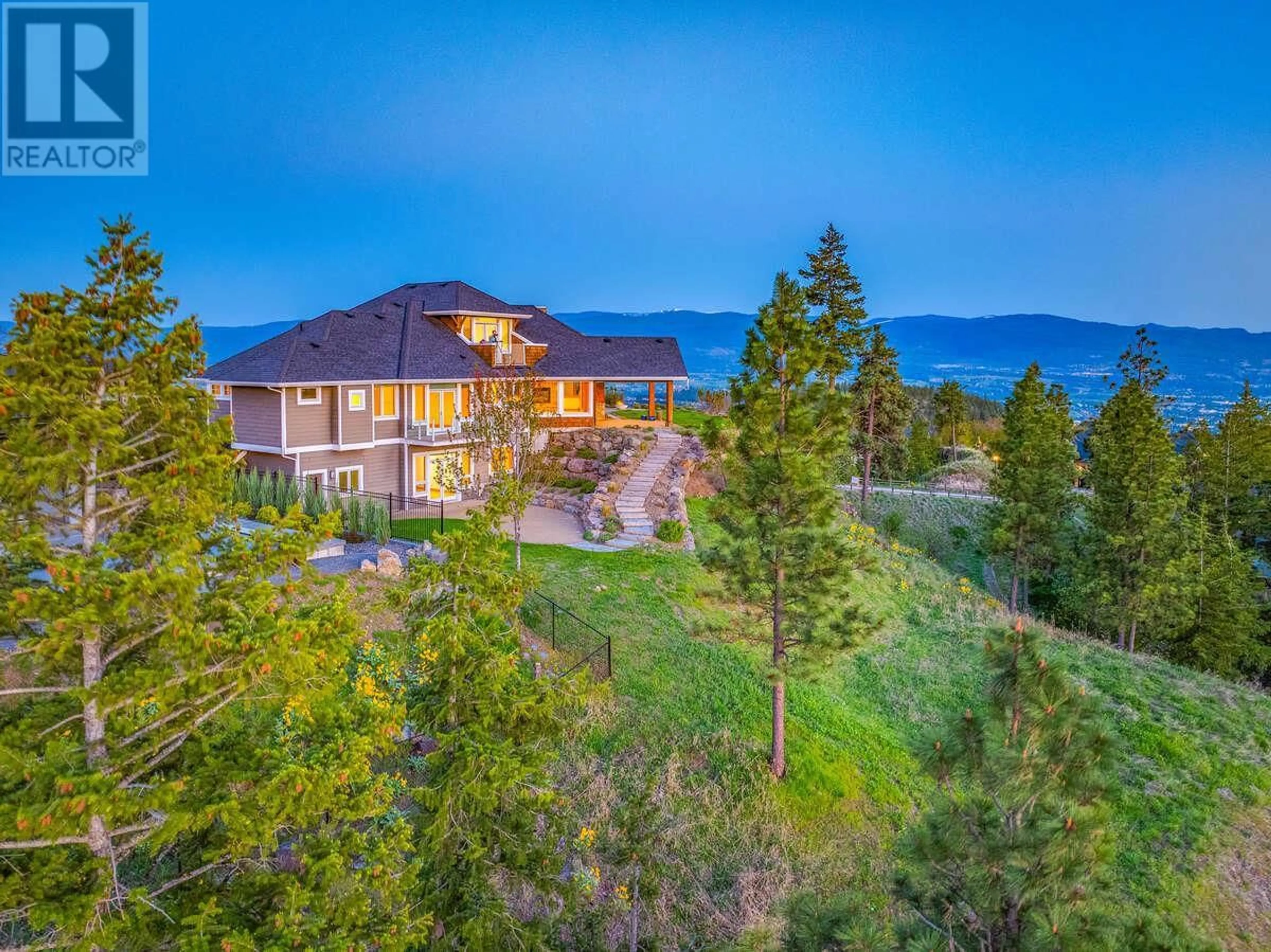 A pic from outside/outdoor area/front of a property/back of a property/a pic from drone, mountain view for 114 SKYLAND DRIVE, Kelowna British Columbia V1V3A3