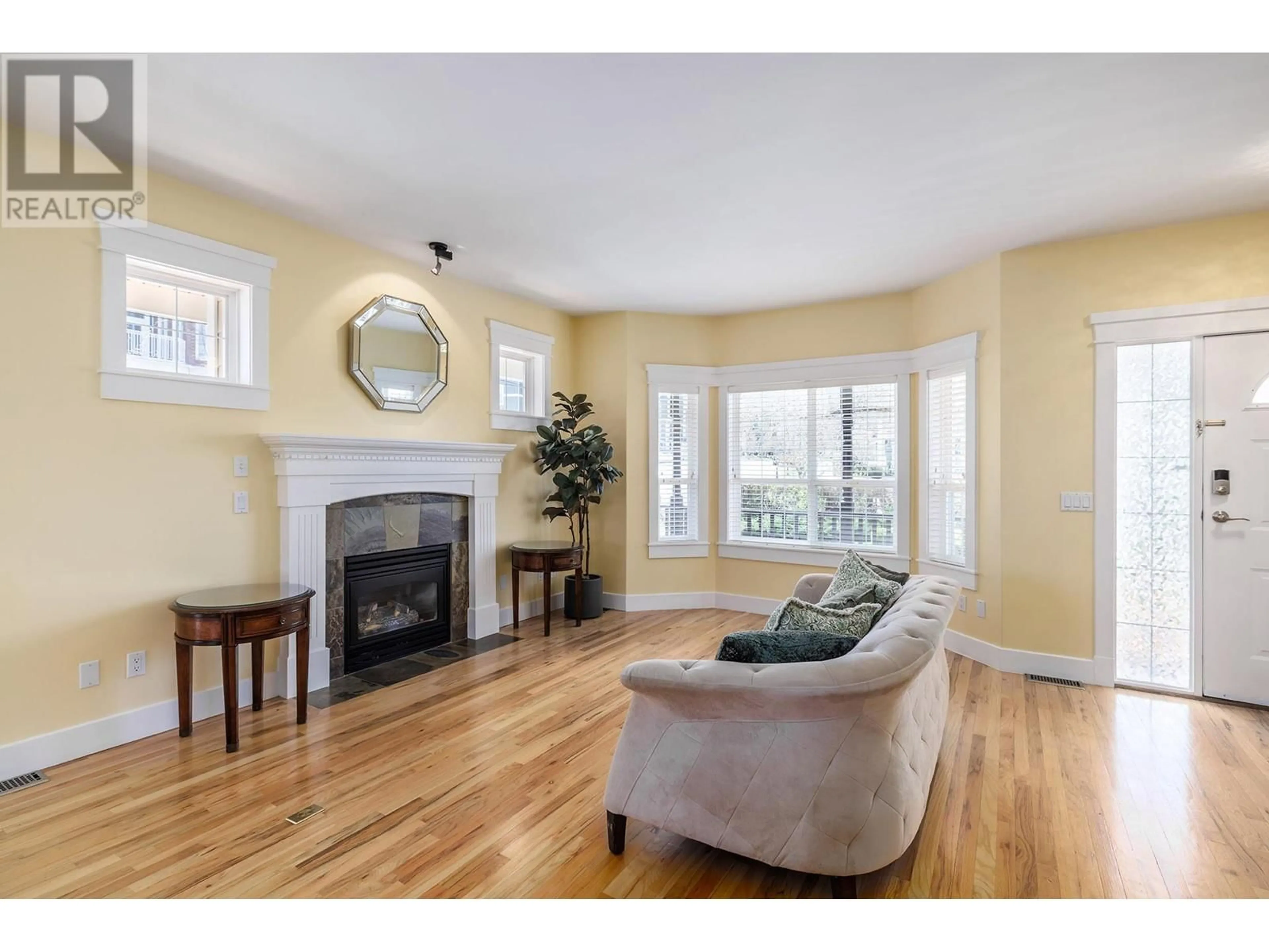 Living room with furniture, wood/laminate floor for 5296 ALLENBY LANE, Kelowna British Columbia V1W4T8