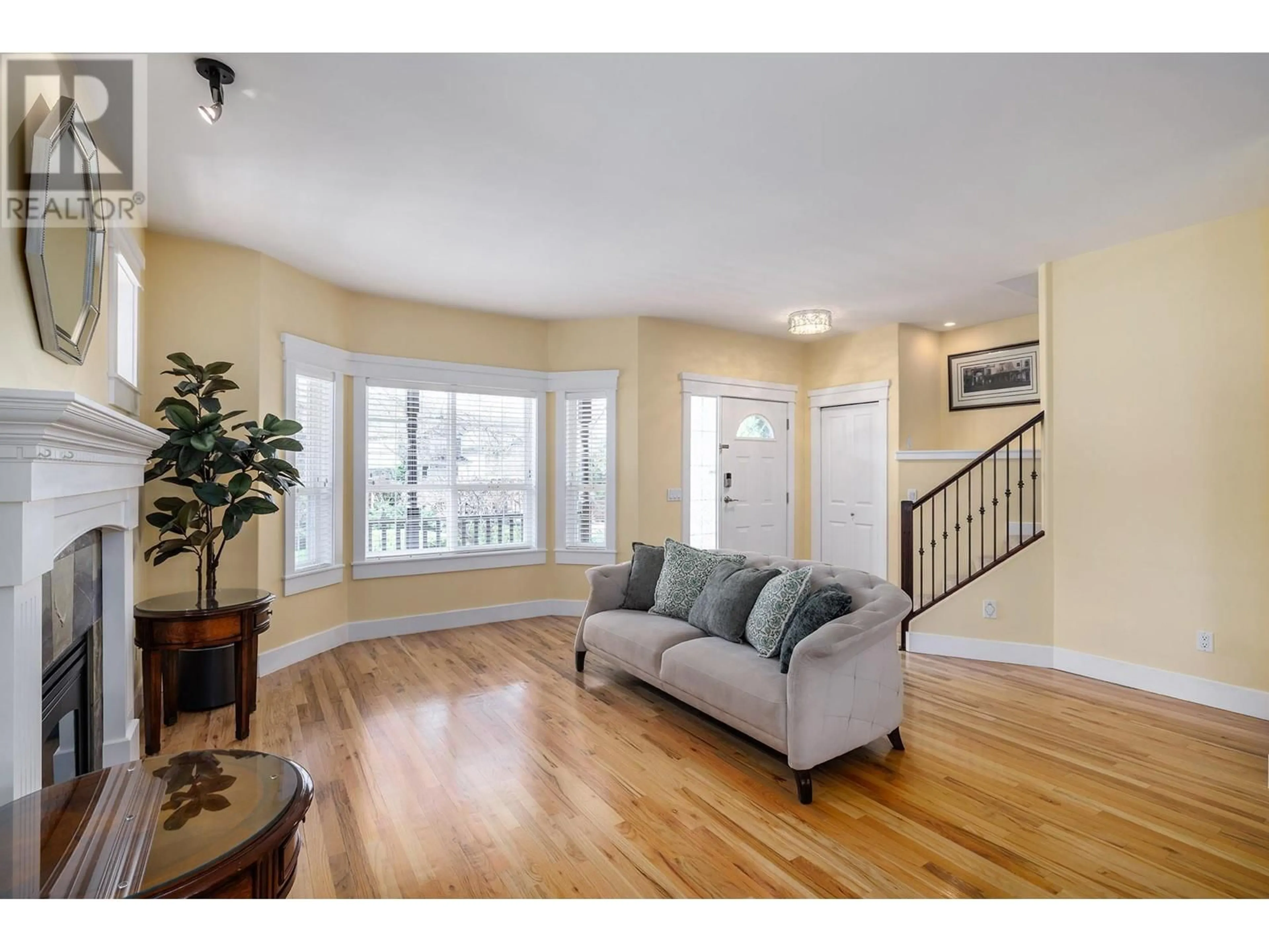 Living room with furniture, wood/laminate floor for 5296 ALLENBY LANE, Kelowna British Columbia V1W4T8