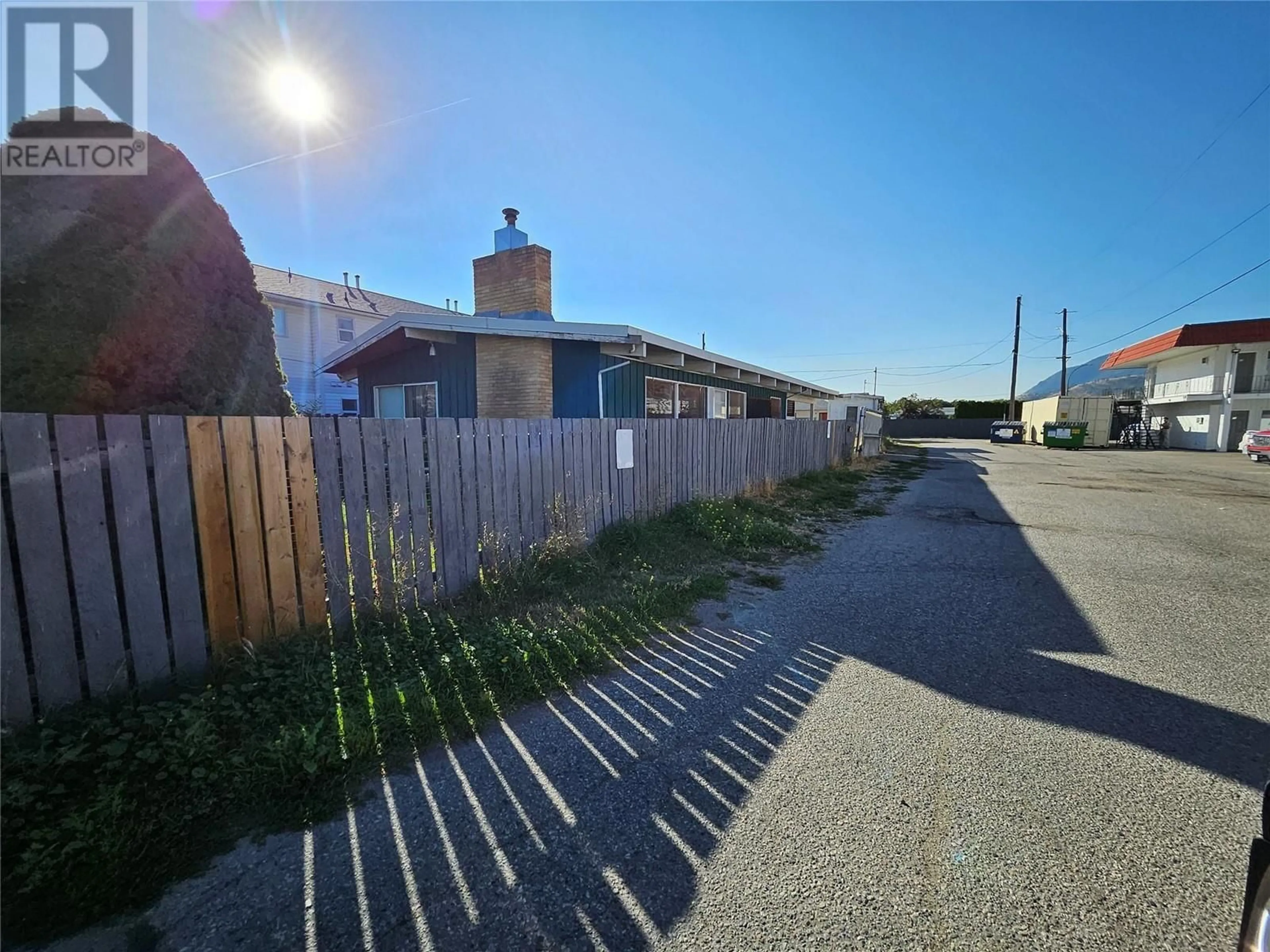 A pic from outside/outdoor area/front of a property/back of a property/a pic from drone, street for 1084 DYNES AVENUE, Penticton British Columbia V2A1G1