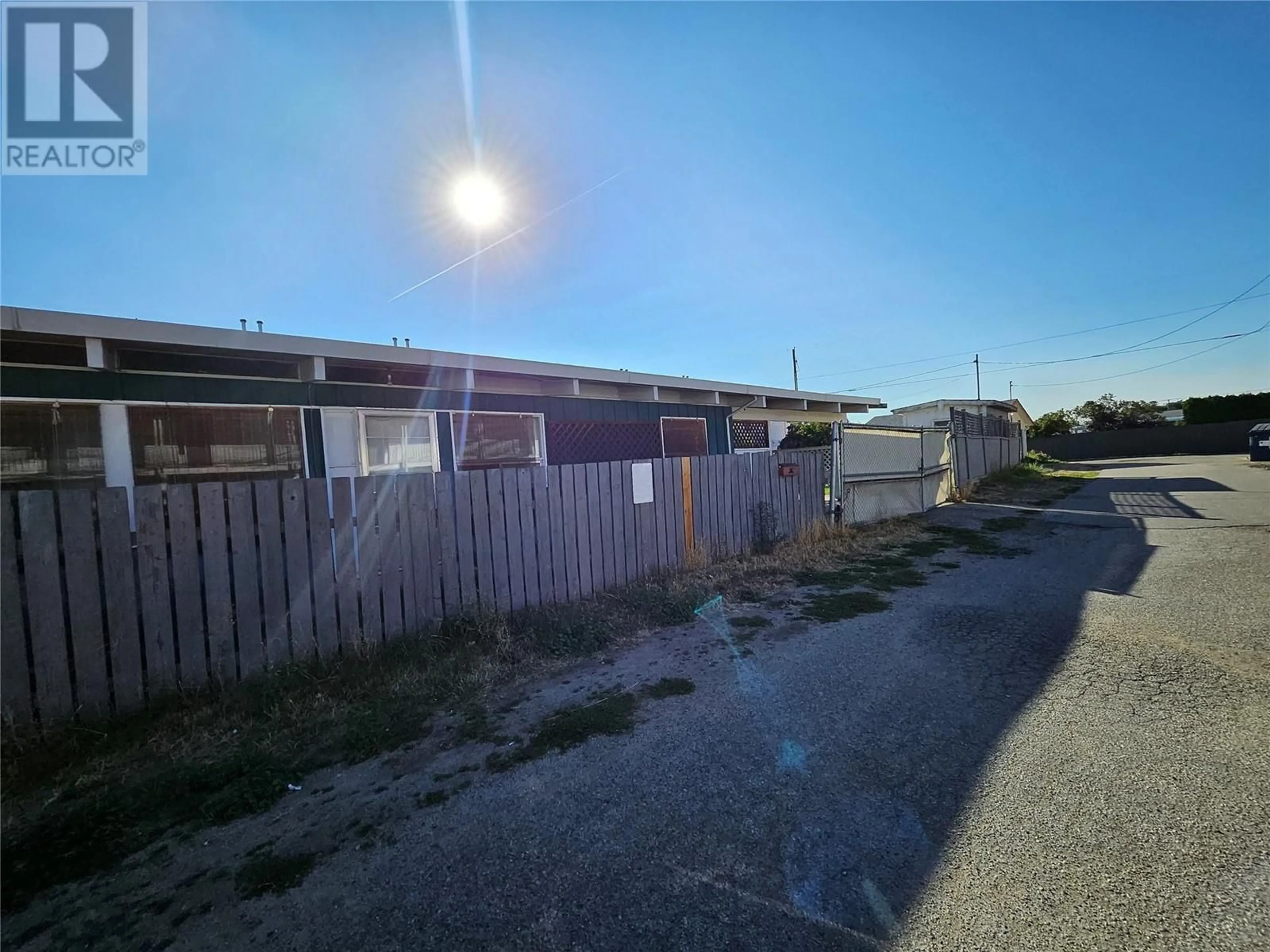 A pic from outside/outdoor area/front of a property/back of a property/a pic from drone, street for 1084 DYNES AVENUE, Penticton British Columbia V2A1G1