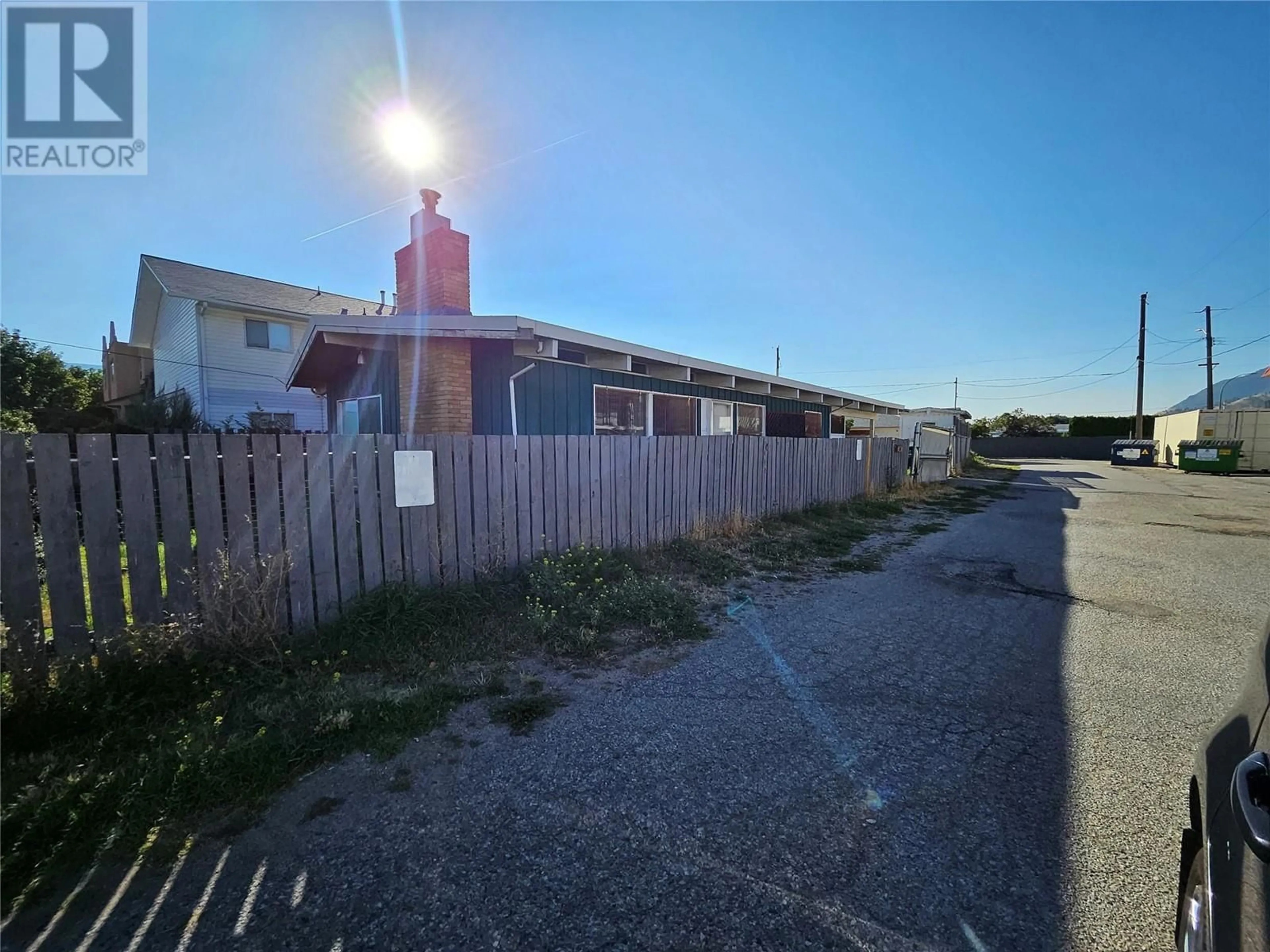 A pic from outside/outdoor area/front of a property/back of a property/a pic from drone, street for 1084 DYNES AVENUE, Penticton British Columbia V2A1G1