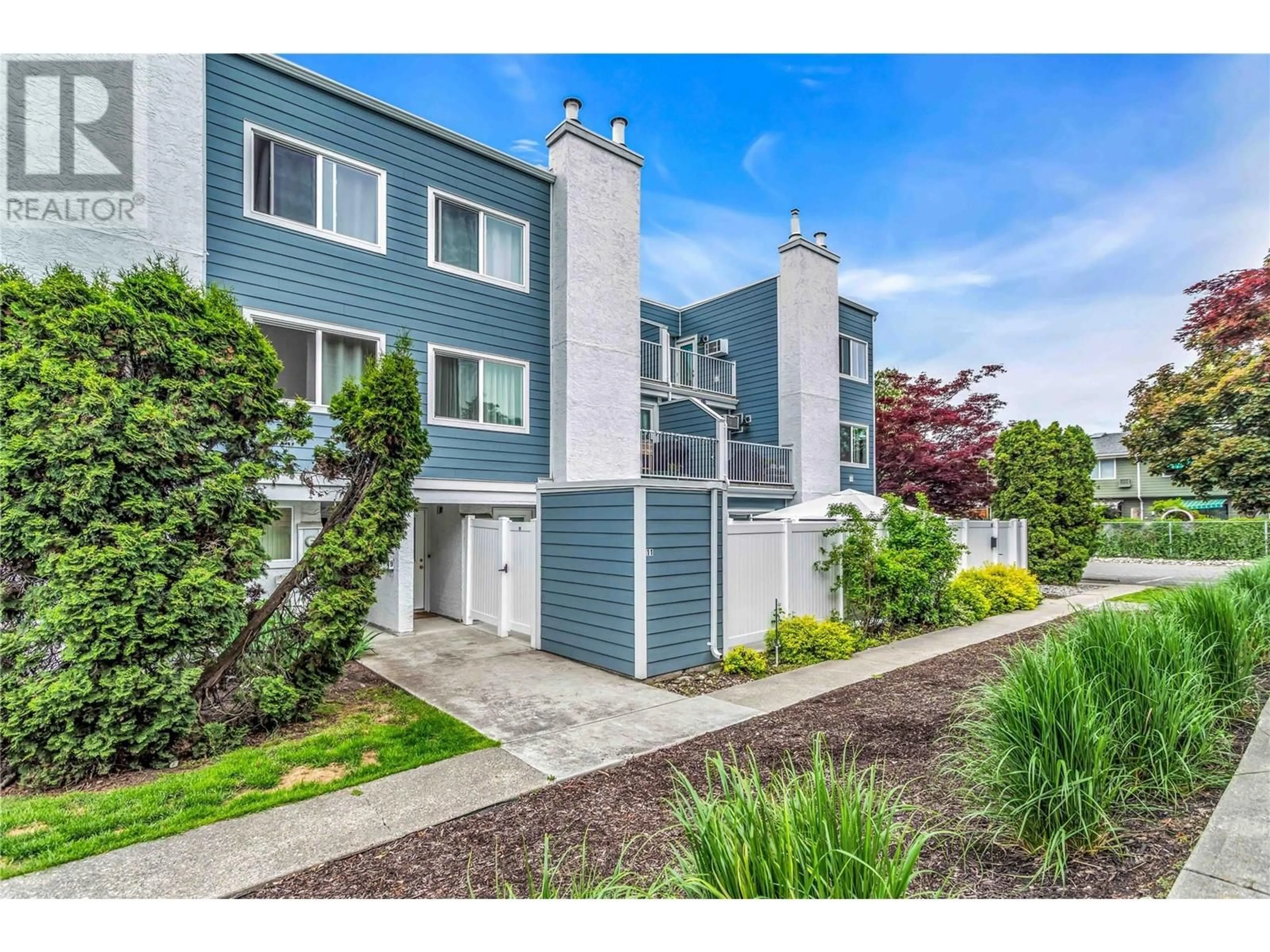 Home with vinyl exterior material, street for 11 - 1481 INKAR ROAD, Kelowna British Columbia V1Y8J1
