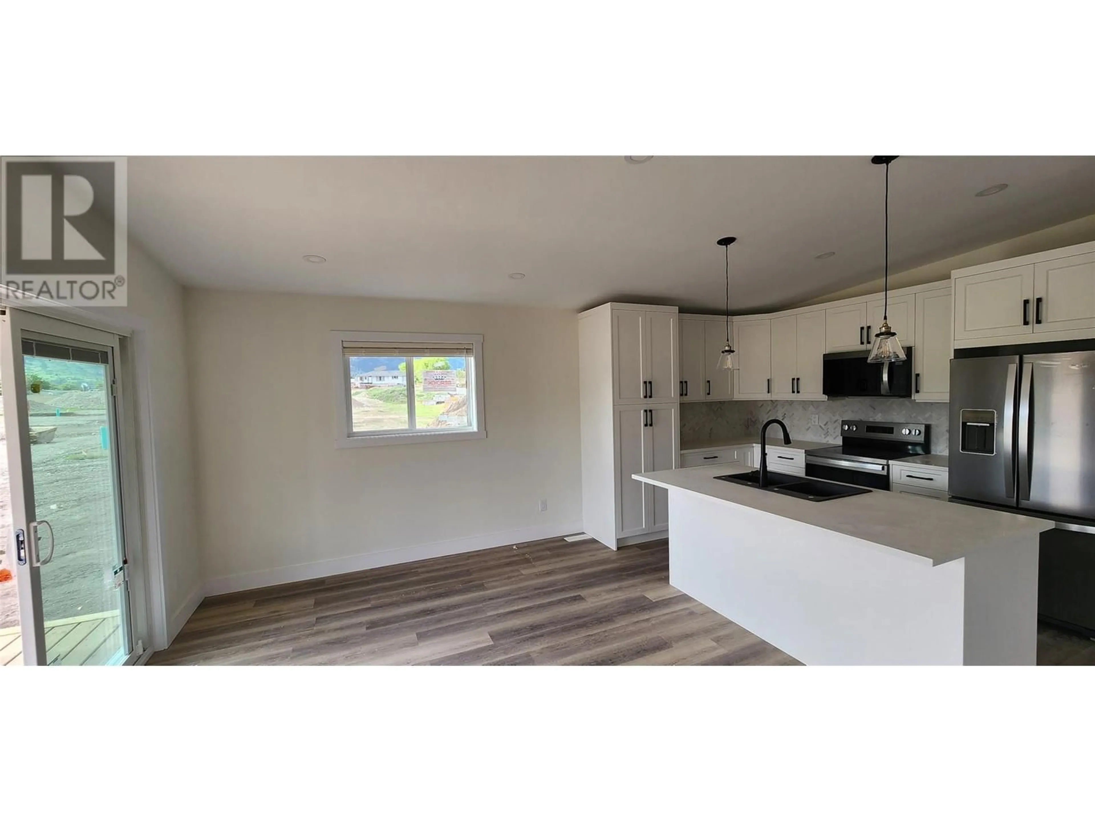 Open concept kitchen, wood/laminate floor for 6830 22ND STREET, Grand Forks British Columbia V0H1H0