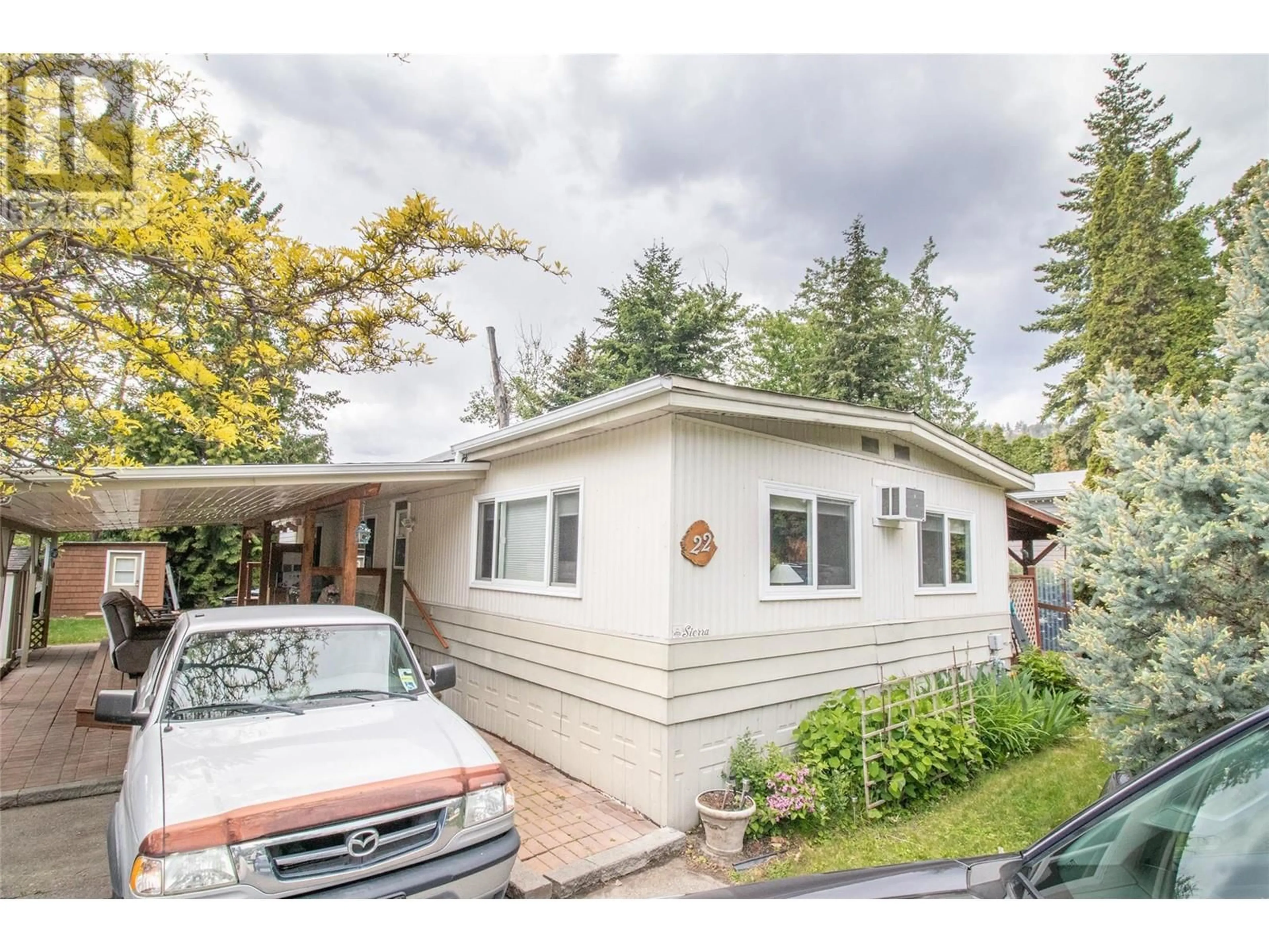 Home with vinyl exterior material, street for 22 - 5432 CHIDLEY ROAD, Peachland British Columbia V0H1X5