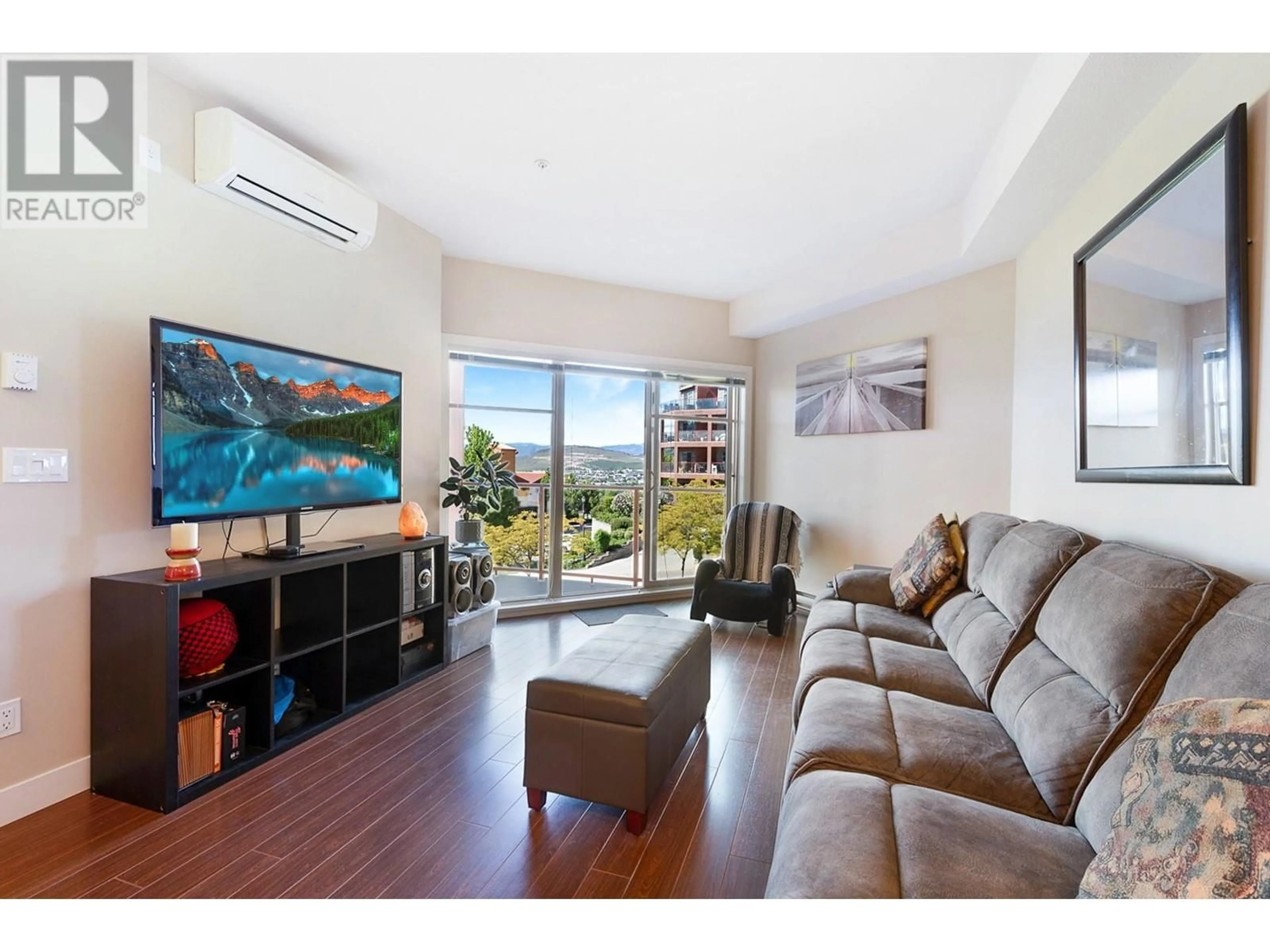 Living room with furniture, wood/laminate floor for 201 - 3211 SKYVIEW LANE, West Kelowna British Columbia V4T3J3