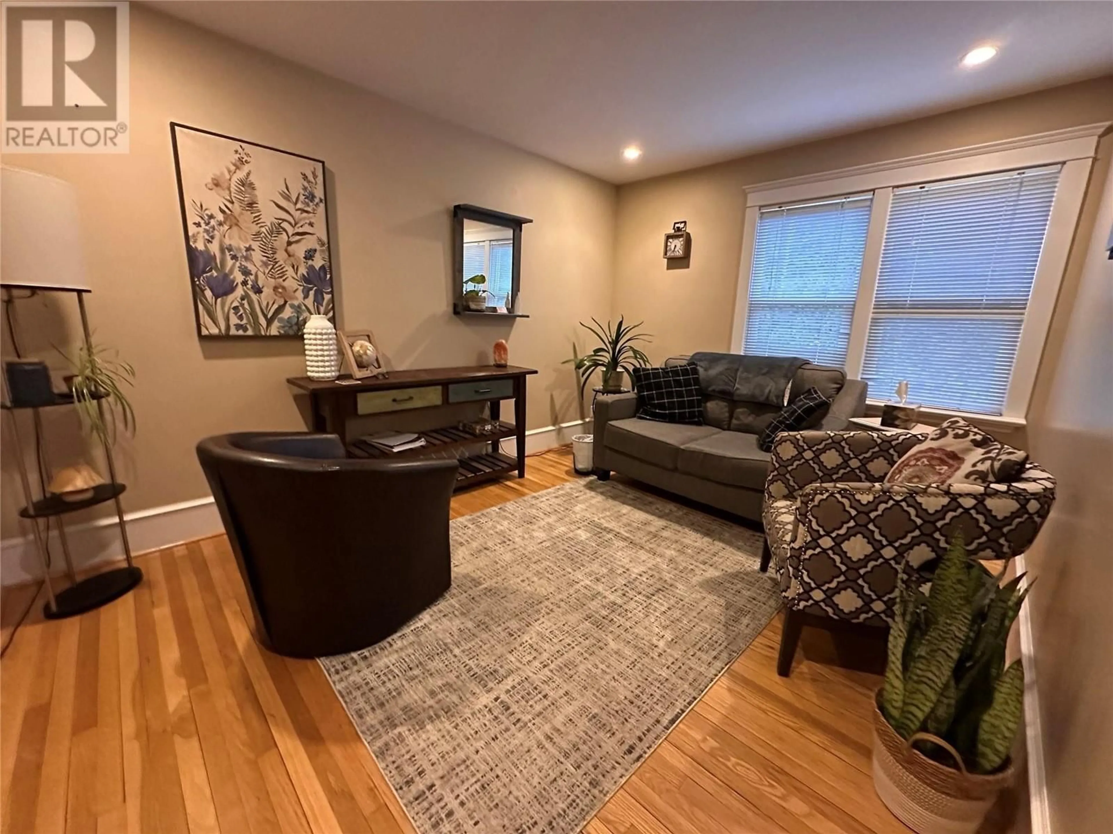 Living room with furniture, wood/laminate floor for 214 11TH AVENUE, Castlegar British Columbia V1N1J2