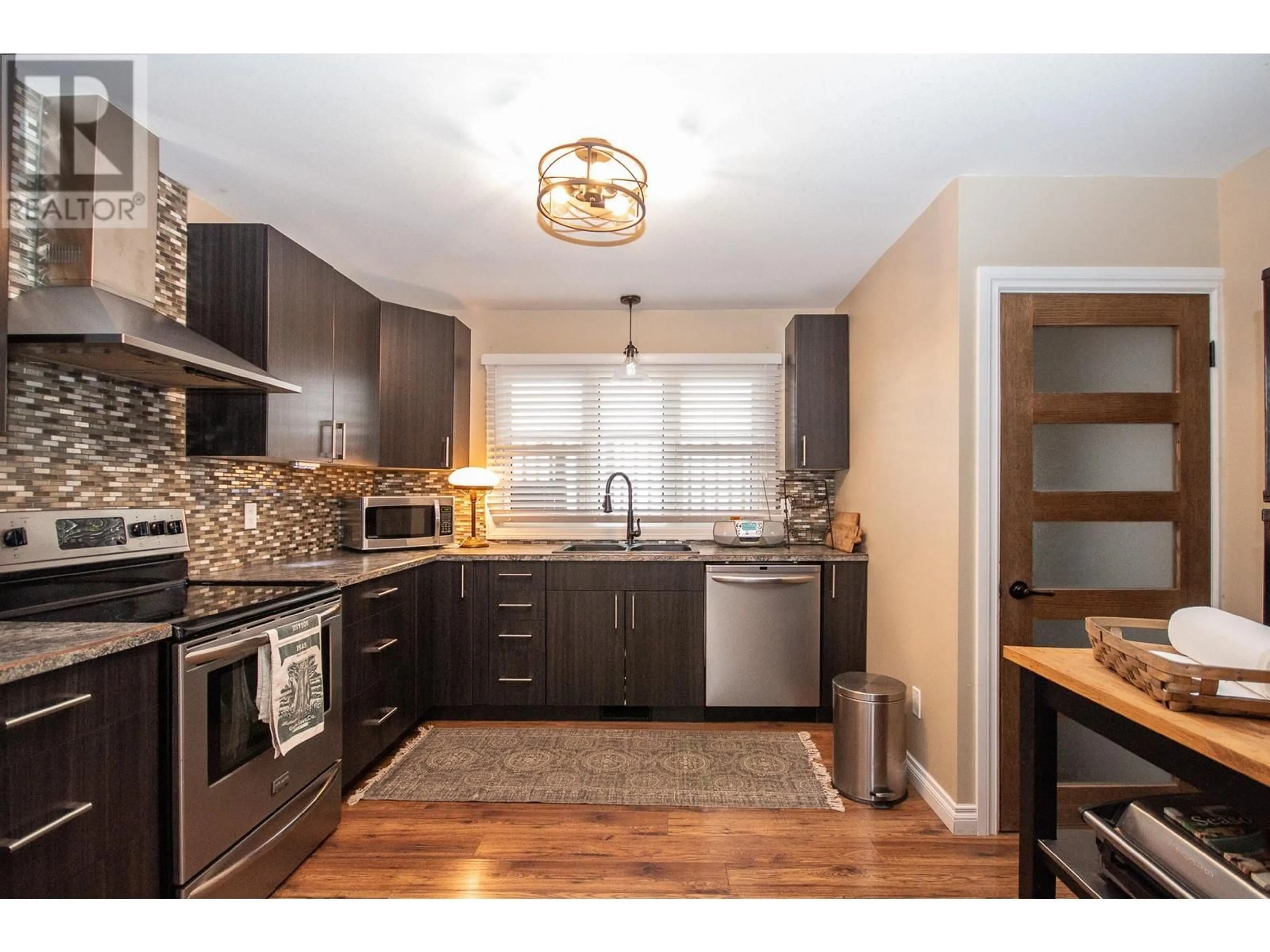 Open concept kitchen, unknown for 1553 95 AVENUE, Dawson Creek British Columbia V1G1J9