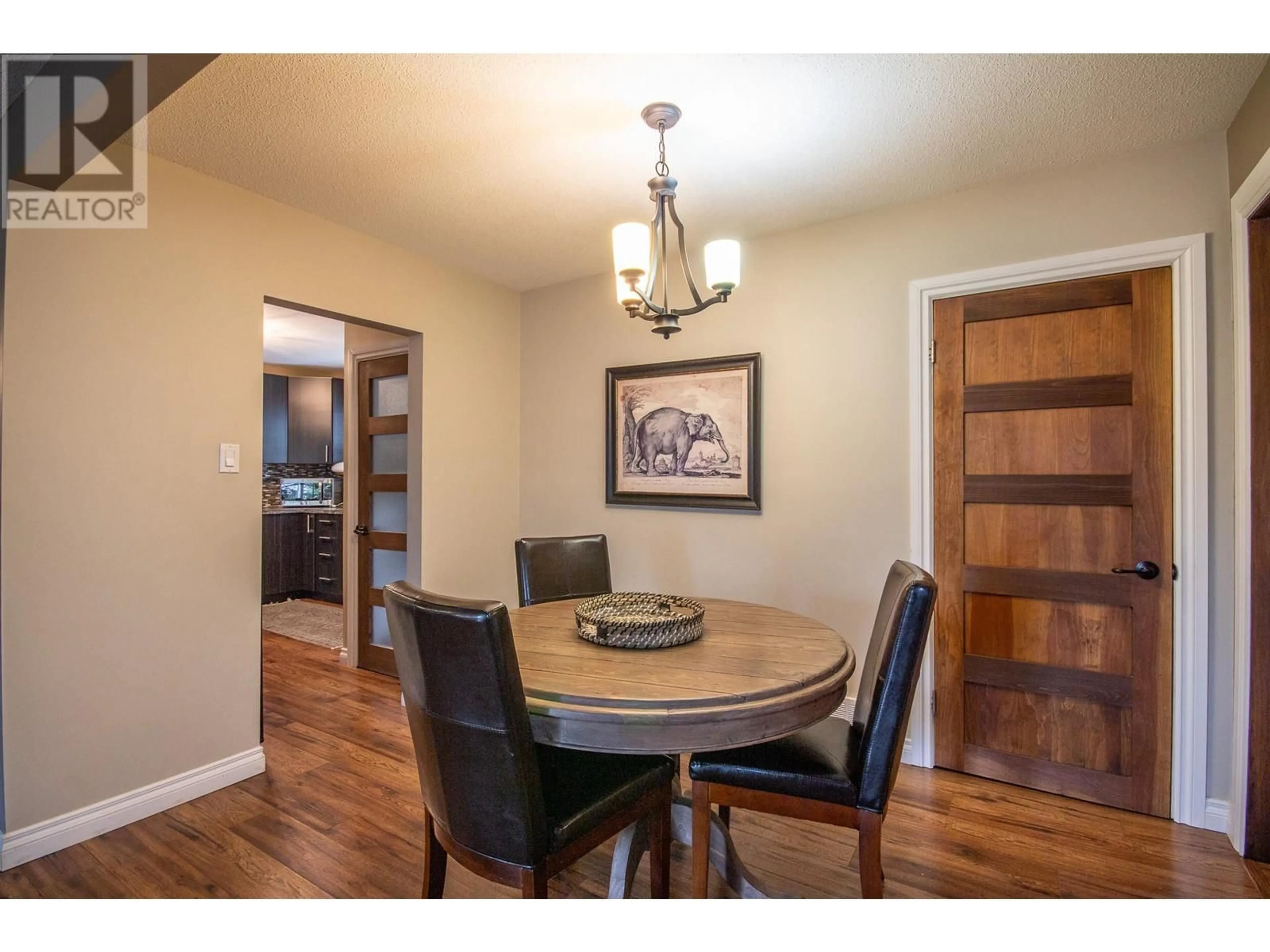 Dining room, wood/laminate floor for 1553 95 AVENUE, Dawson Creek British Columbia V1G1J9