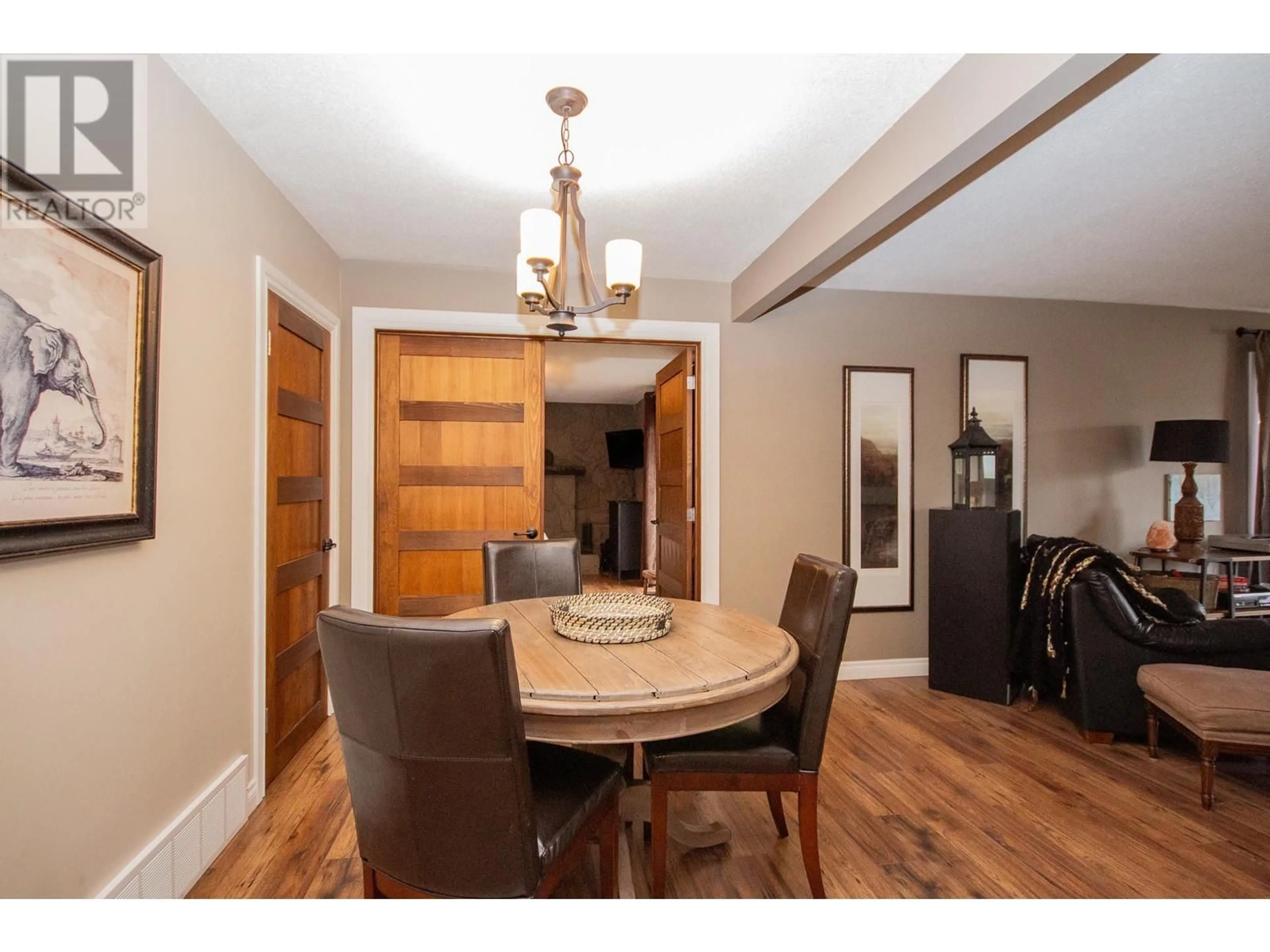 Dining room, wood/laminate floor for 1553 95 AVENUE, Dawson Creek British Columbia V1G1J9