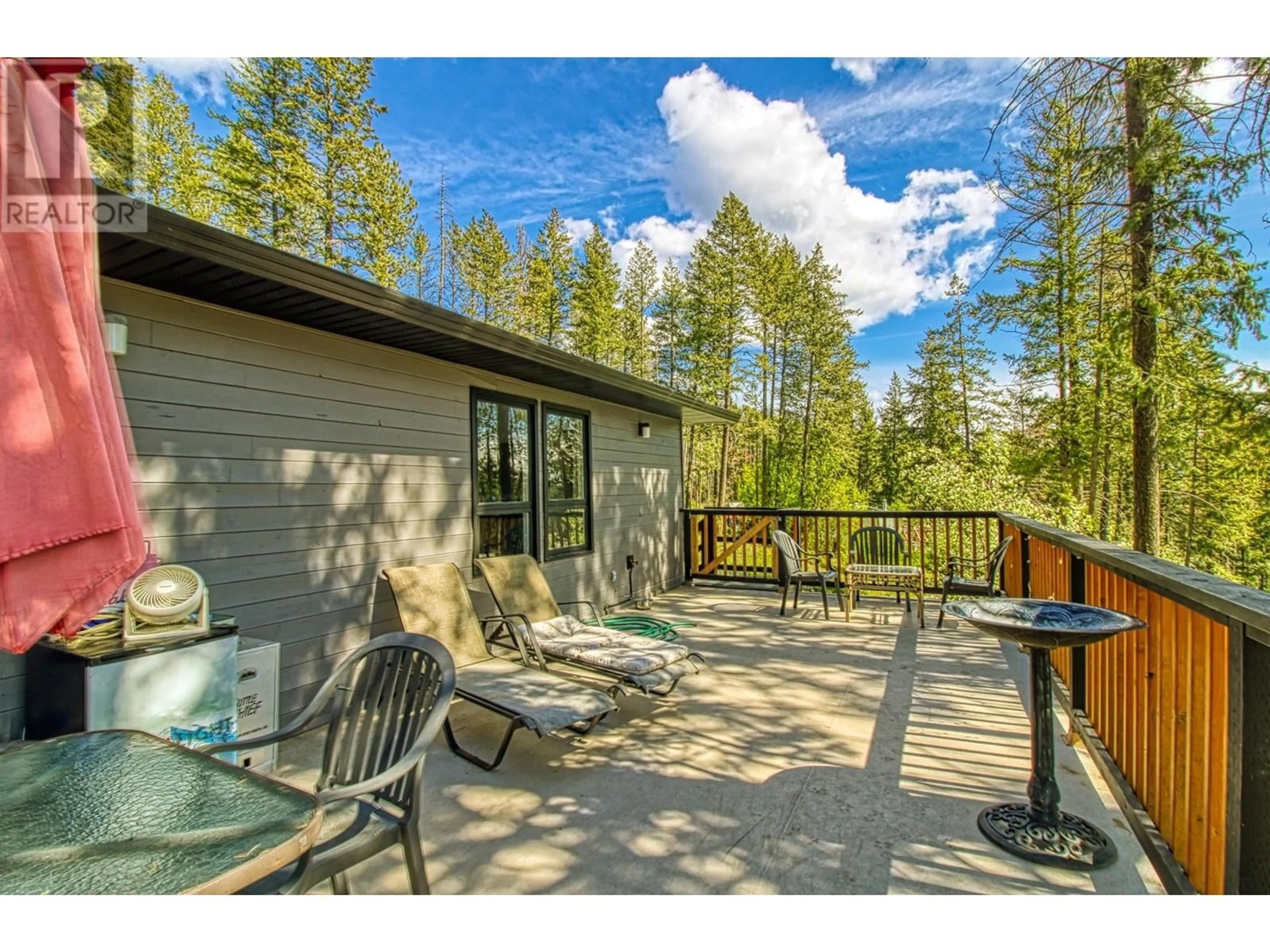 Patio, forest/trees view for 9580 HOUGHTON ROAD, Vernon British Columbia V1H2C9