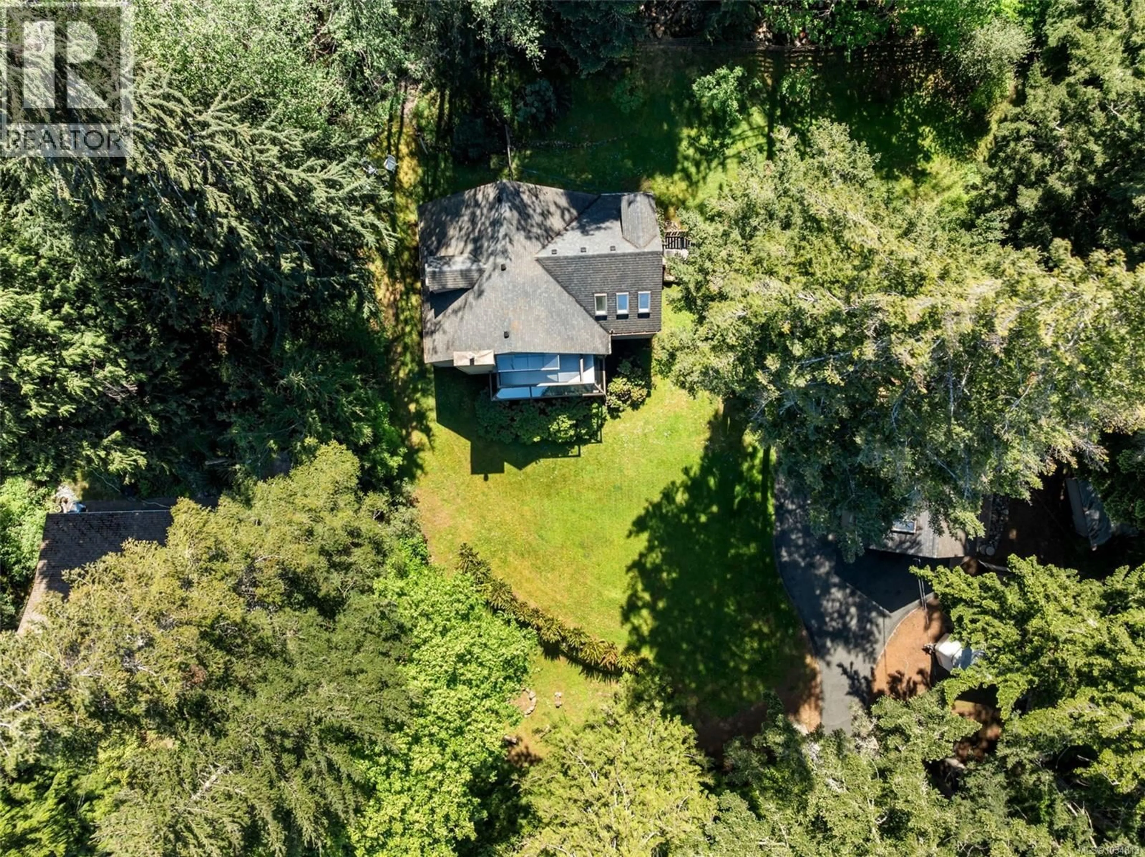 A pic from outside/outdoor area/front of a property/back of a property/a pic from drone, forest/trees view for 6089 BRECON DRIVE, Sooke British Columbia V9Z1B1